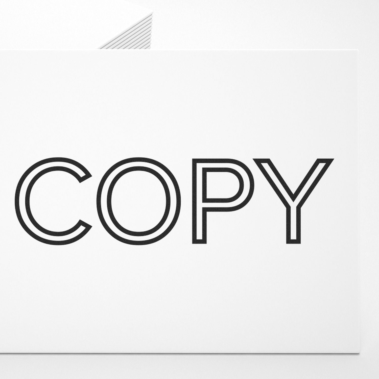 Slim Pre-Inked Outline Font Copy Stamp used to create the word COPY in black outline font on a white background.