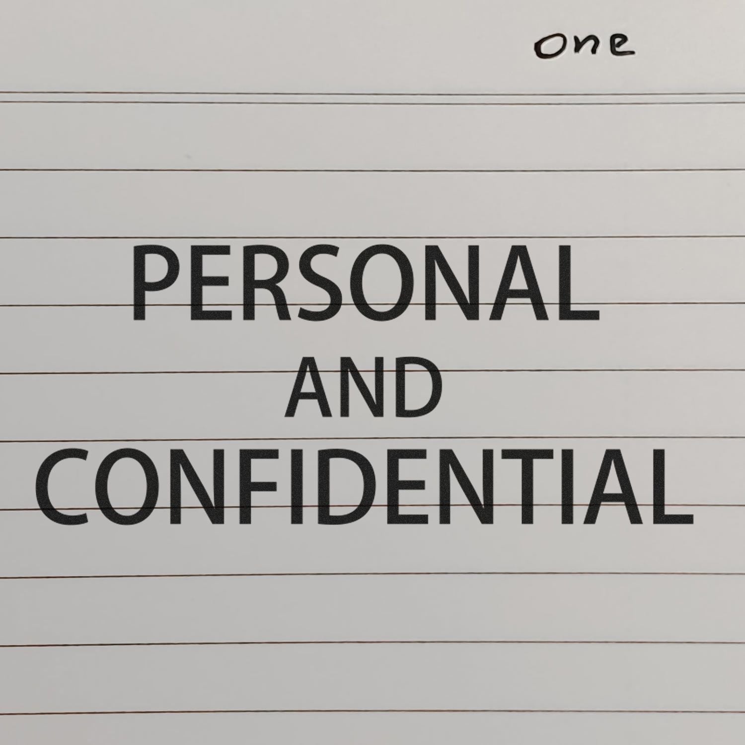 Slim Pre-Inked Personal Confidential Stamp marking PERSONAL AND CONFIDENTIAL on a lined paper with the word one handwritten at the top.