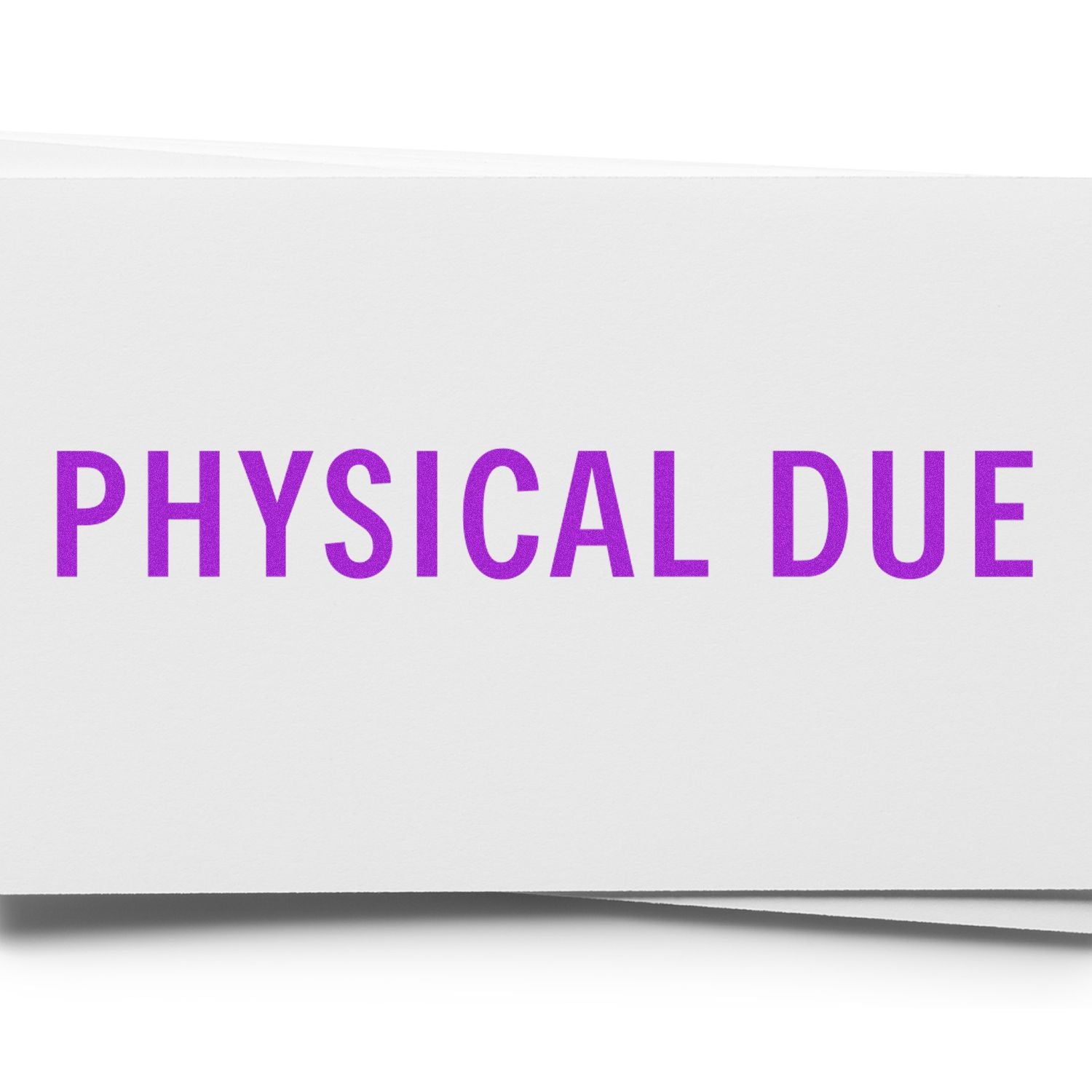 Close-up of a white paper stamped with 'PHYSICAL DUE' in bold purple letters using a rubber stamp.