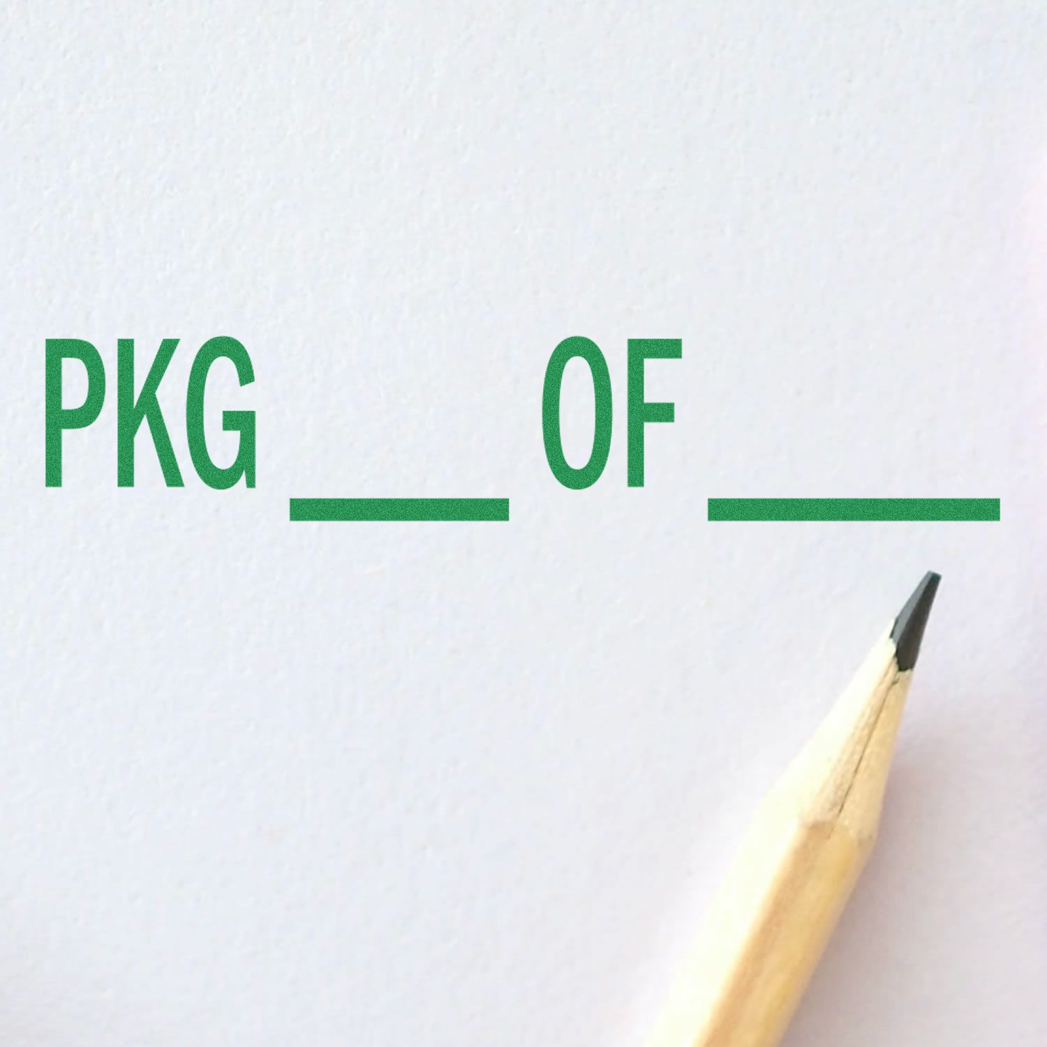 Pkg Of Mailing Rubber Stamp in green ink on white paper with a pencil tip pointing towards the text.