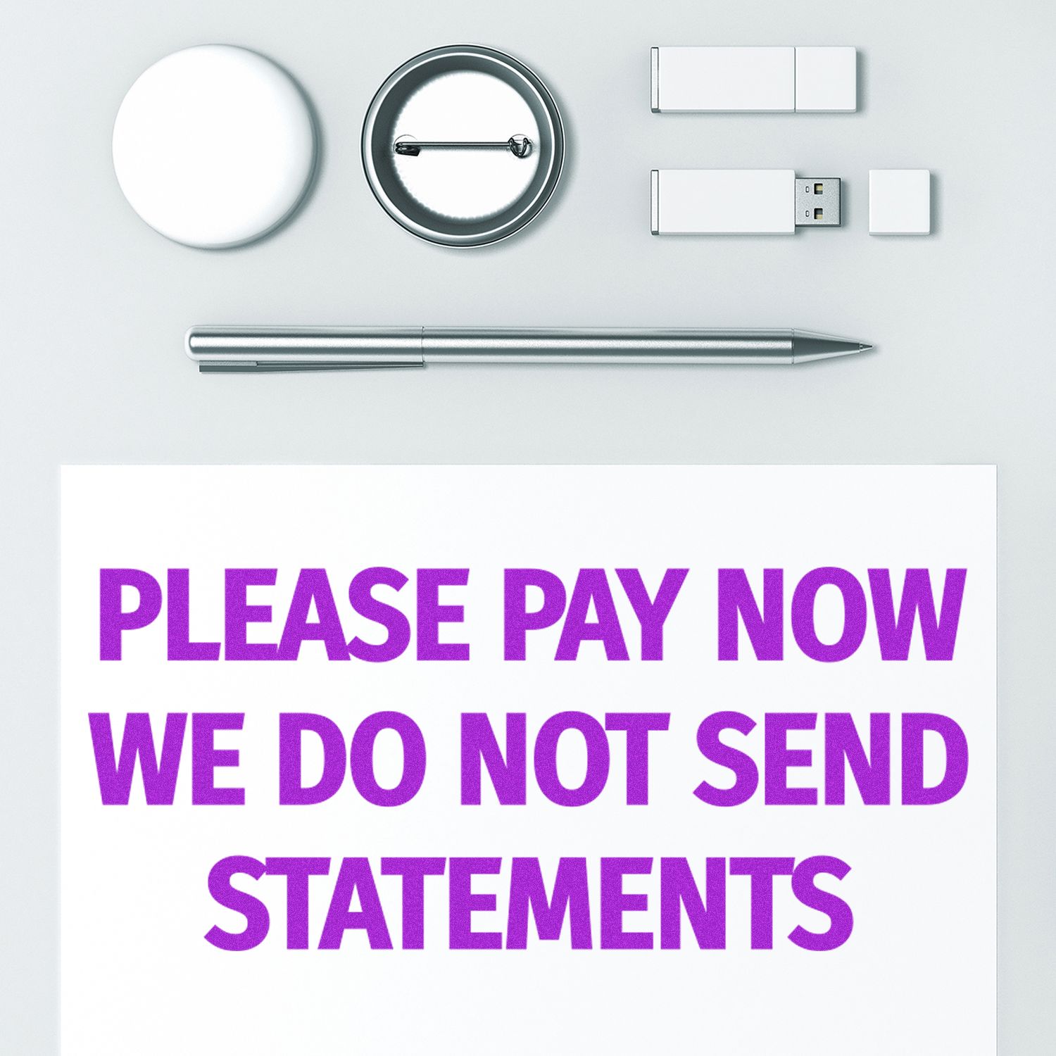 Please Pay Now No Statements will be Sent Rubber Stamp in purple ink on white paper, surrounded by office supplies.