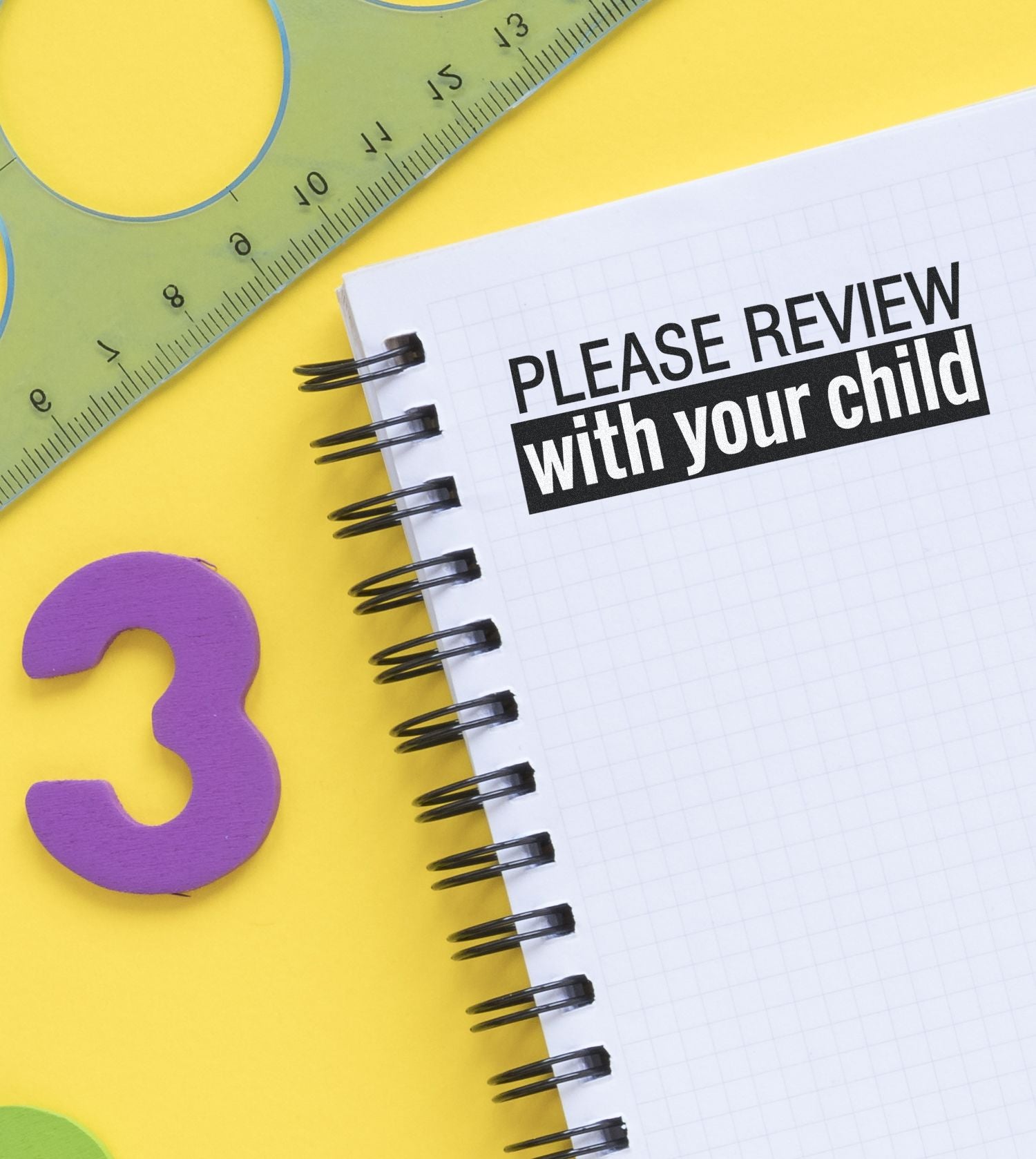 Large Self Inking Please Review with your child Stamp used on a spiral notebook, surrounded by a ruler, stencil, and a purple number 3.