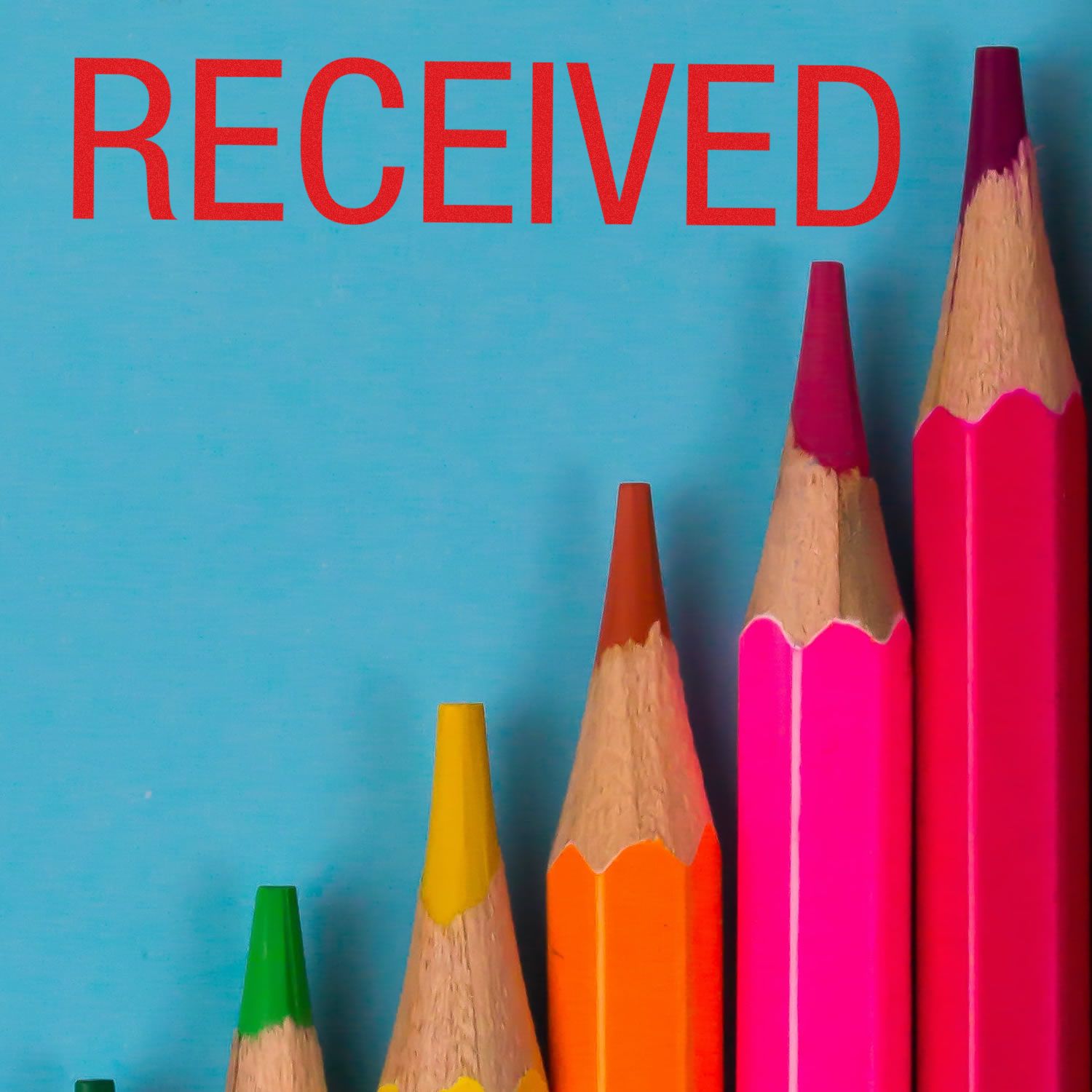 Colorful pencils arranged in ascending order with a red Received rubber stamp text above them on a blue background.