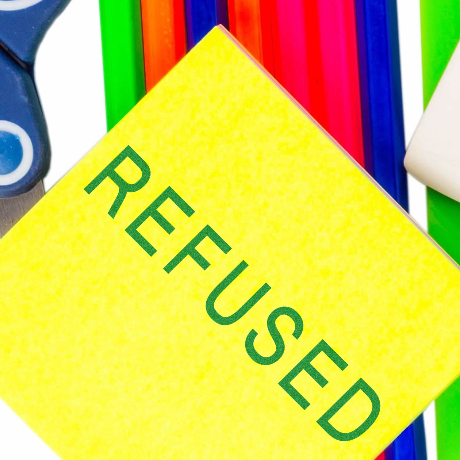 Yellow paper stamped with REFUSED in green ink using a Slim Pre-Inked Refused Stamp, surrounded by colorful stationery.