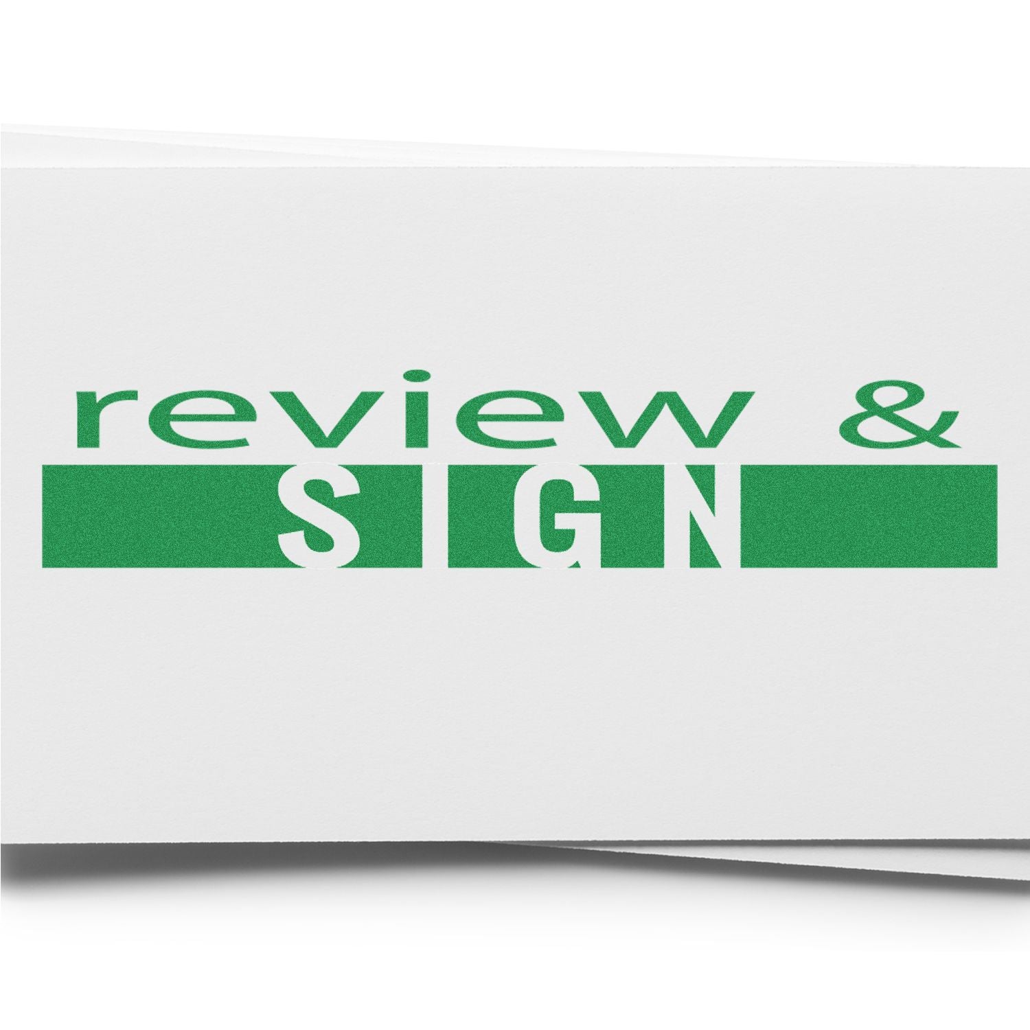 Slim Pre-Inked Review and Sign Stamp in green ink on white paper, emphasizing the words review & SIGN in bold letters.