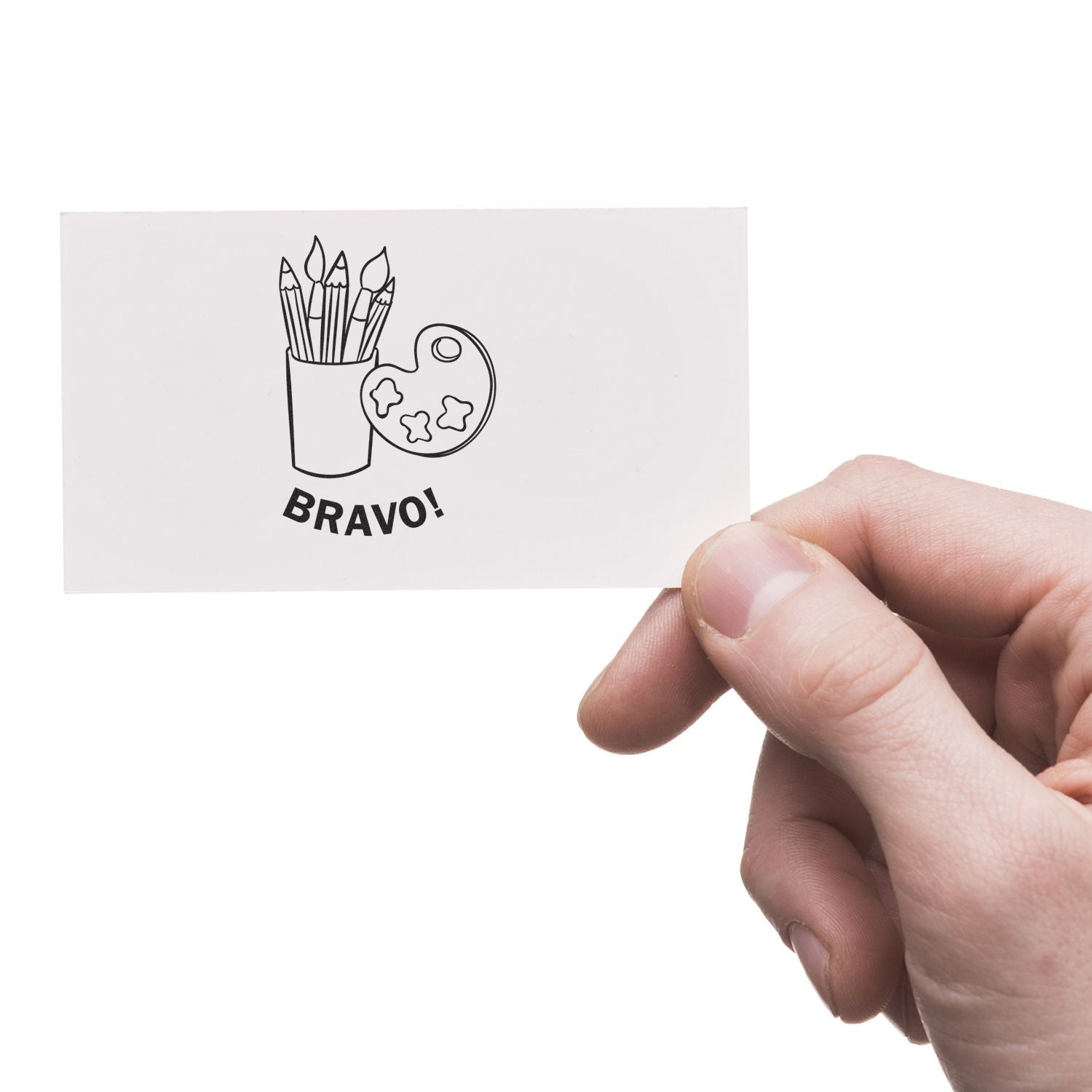 Hand holding a card with a Round Bravo Rubber Stamp design featuring paintbrushes in a cup and a palette with the word BRAVO!