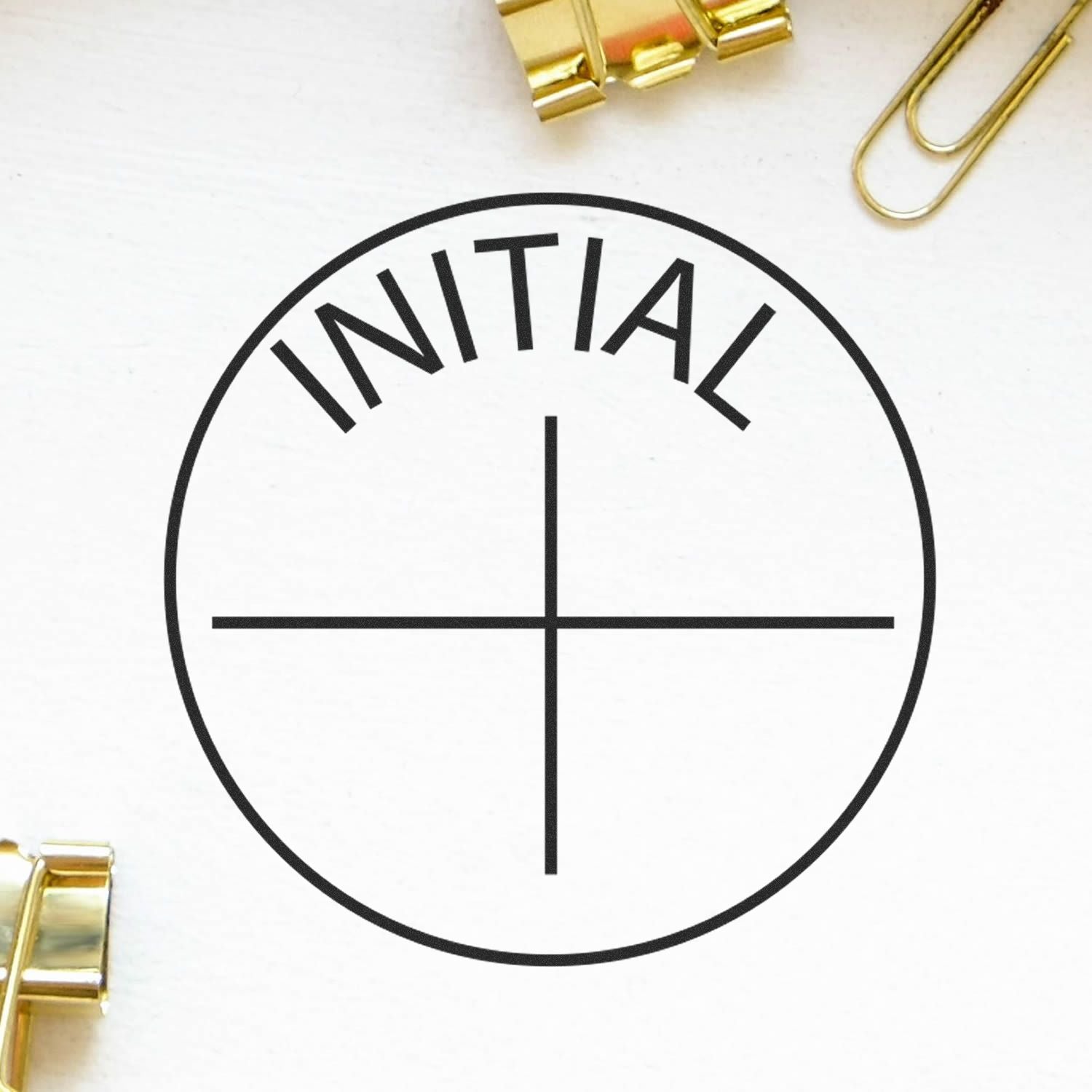 Round Initial Rubber Stamp with the word INITIAL in the center, surrounded by gold paper clips and a white background.