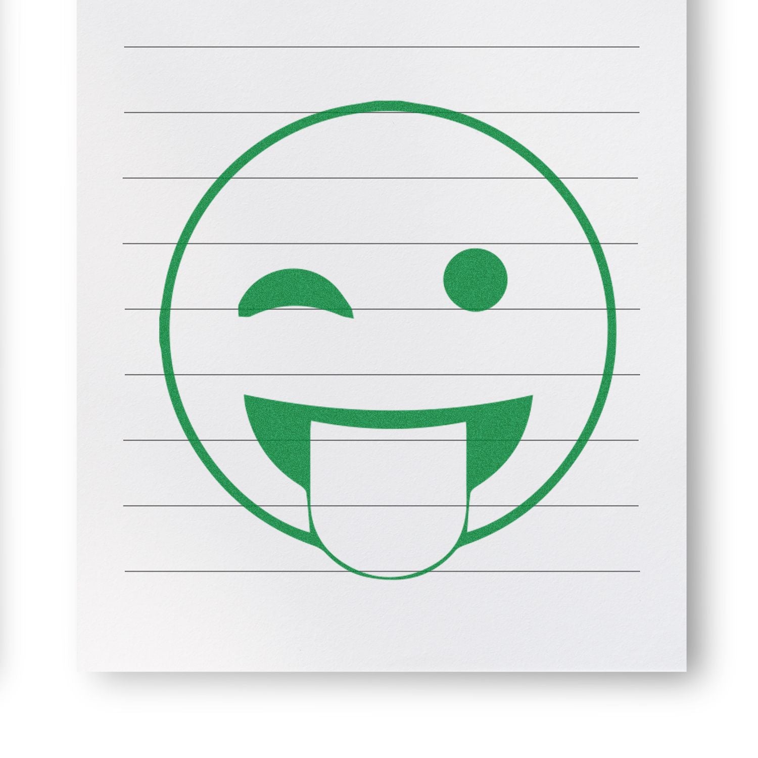 Round Tongue Out Smiley Rubber Stamp in green ink on lined white paper, showing a winking face with its tongue sticking out.