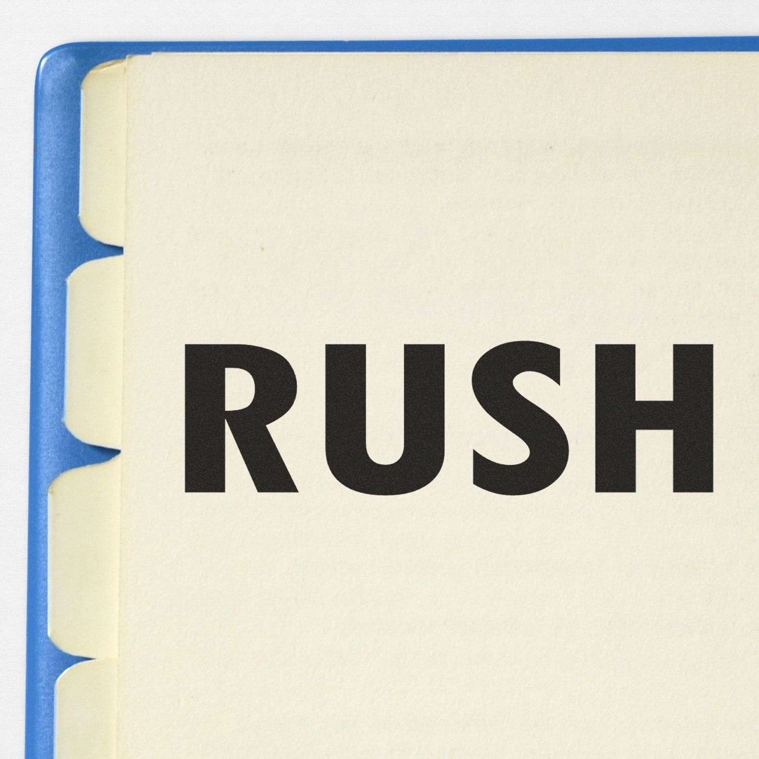 Close-up of a document with a blue tabbed folder and a bold 'RUSH' rubber stamp mark on the top page.