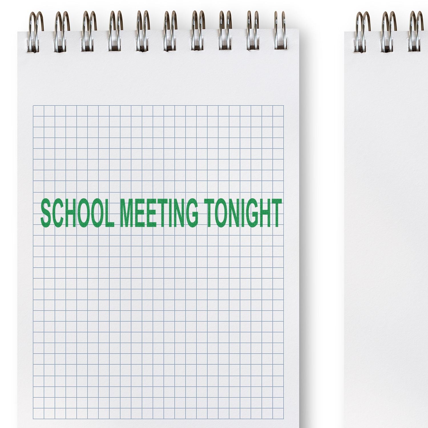 Large Self Inking School Meeting Tonight Stamp used on a graph paper notebook, displaying green text SCHOOL MEETING TONIGHT in bold letters.