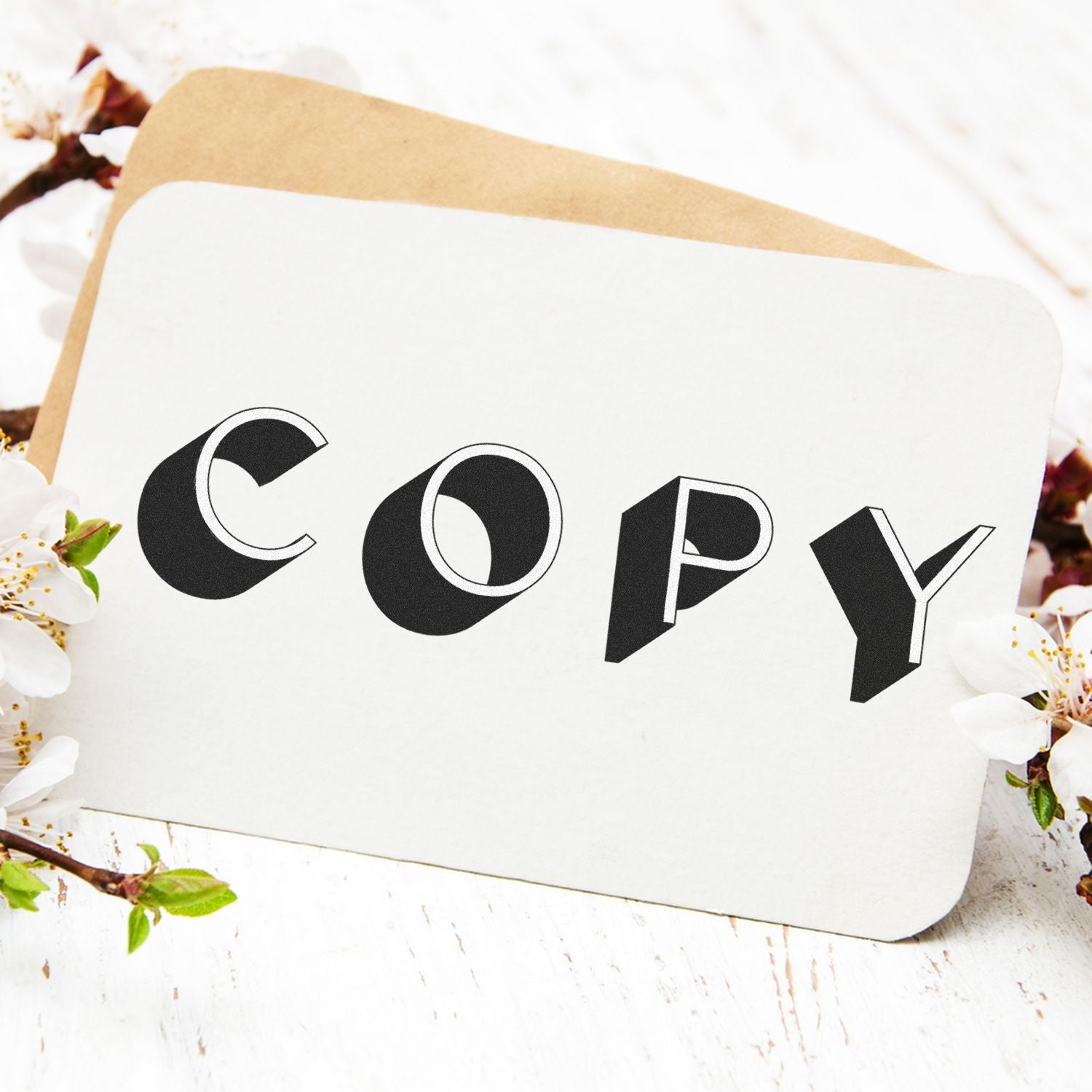 A card stamped with COPY using a Slim Pre-Inked Shadow Copy Stamp, surrounded by white flowers and a brown envelope.