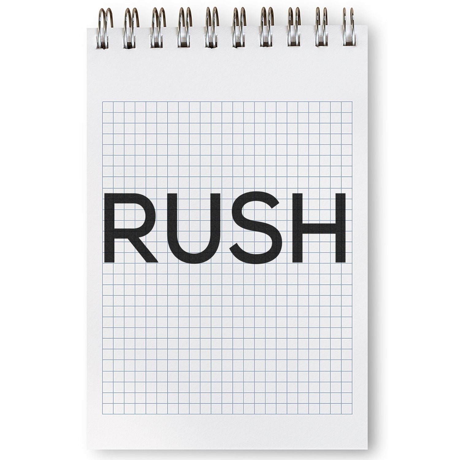 Notebook with grid paper stamped with 'RUSH' using a Slim Pre-Inked Skinny Rush Stamp, emphasizing urgency in bold letters.