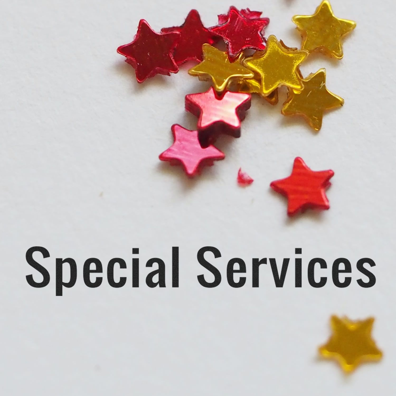 Special Services text stamped on paper with a Slim Pre-Inked Special Services Stamp, surrounded by red and gold star confetti.