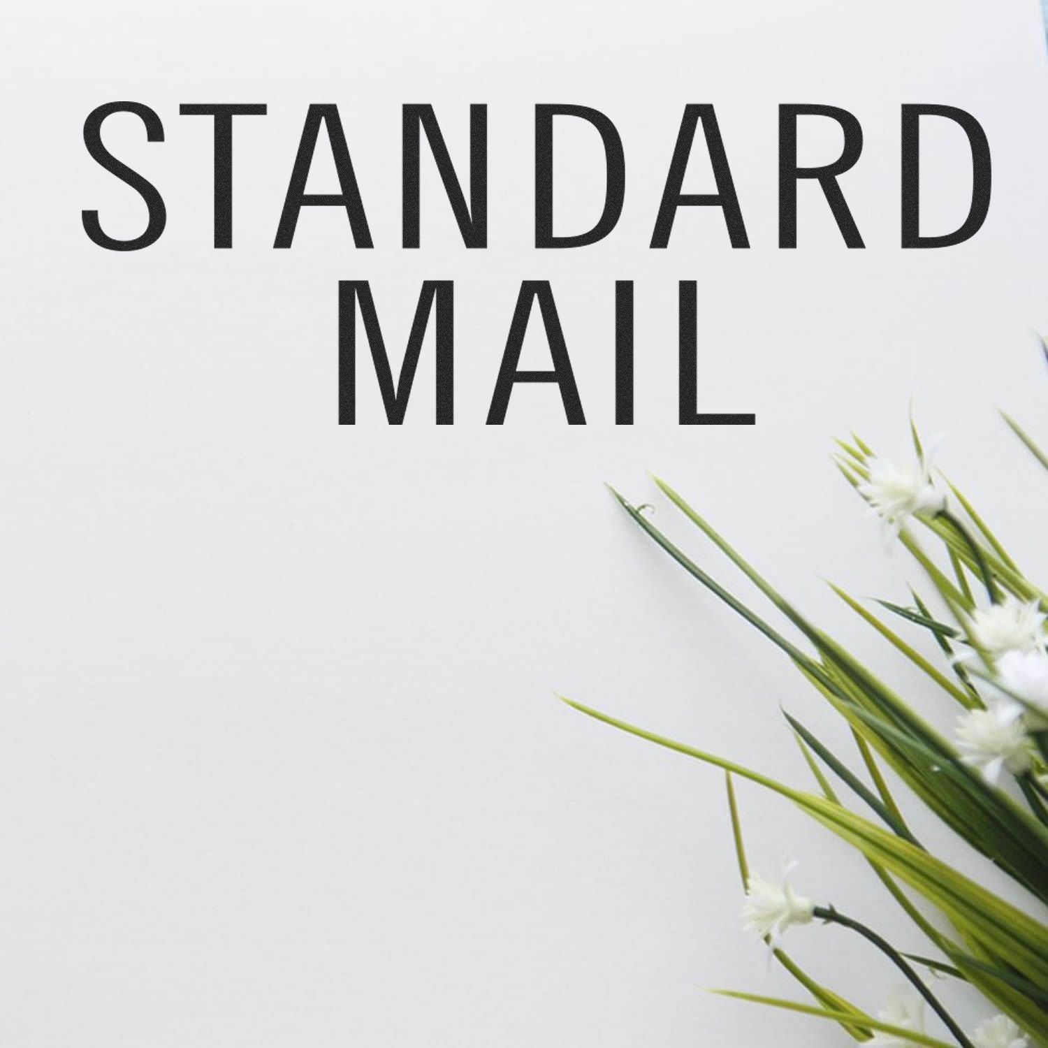 Standard Mail Stacked Rubber Stamp text on a white background with green and white flowers on the right side.