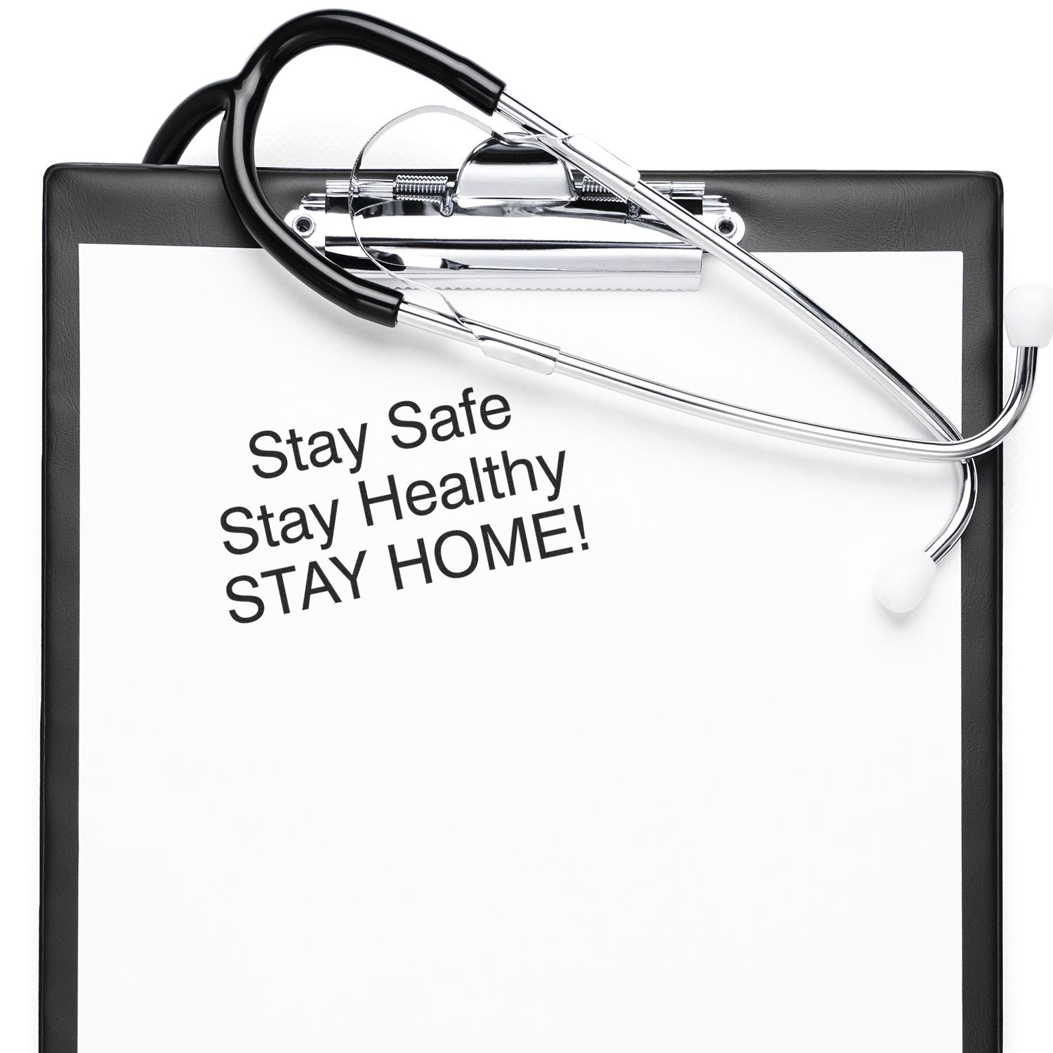 Clipboard with a stethoscope and a Stay Safe Stay Healthy Rubber Stamp message stamped on paper, urging to stay home.