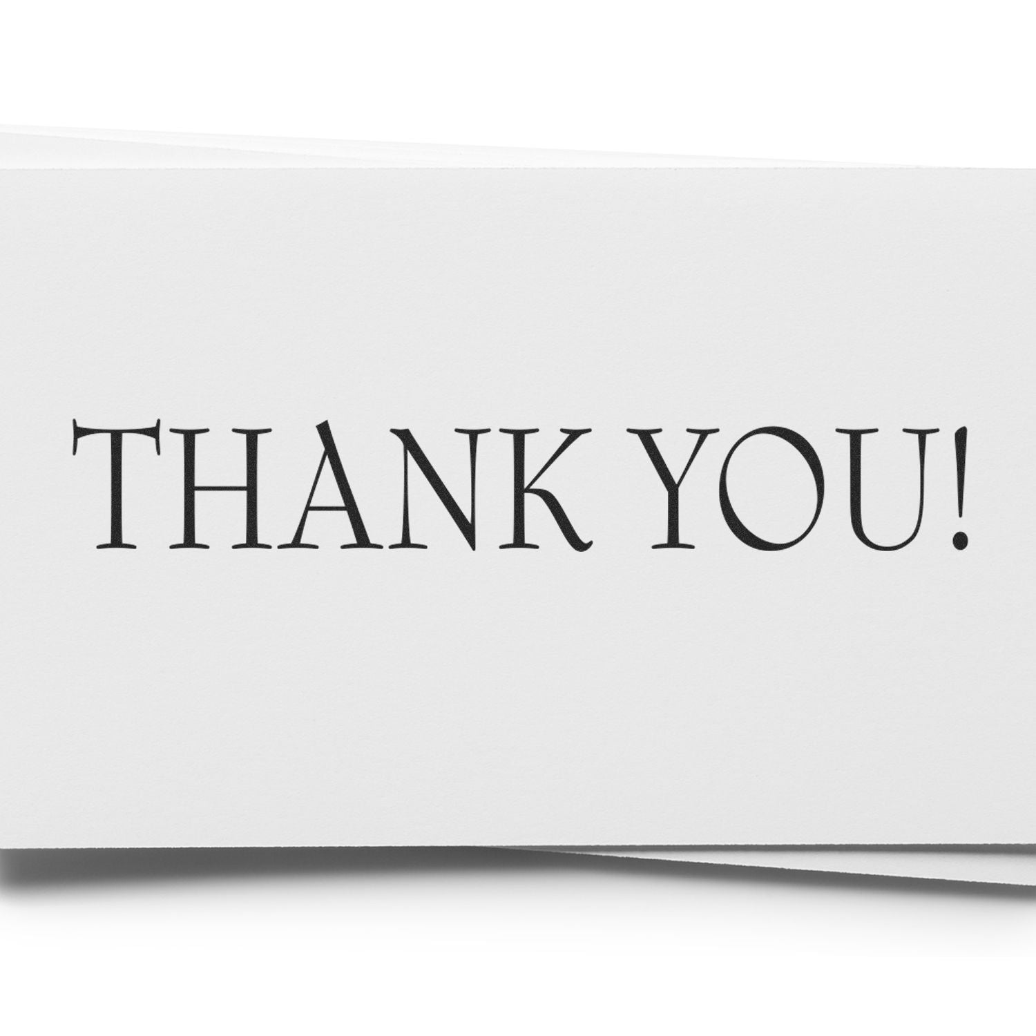 A white card stamped with THANK YOU! in black ink using the Large Pre-Inked Thank You Stamp, showcasing clear and bold lettering.