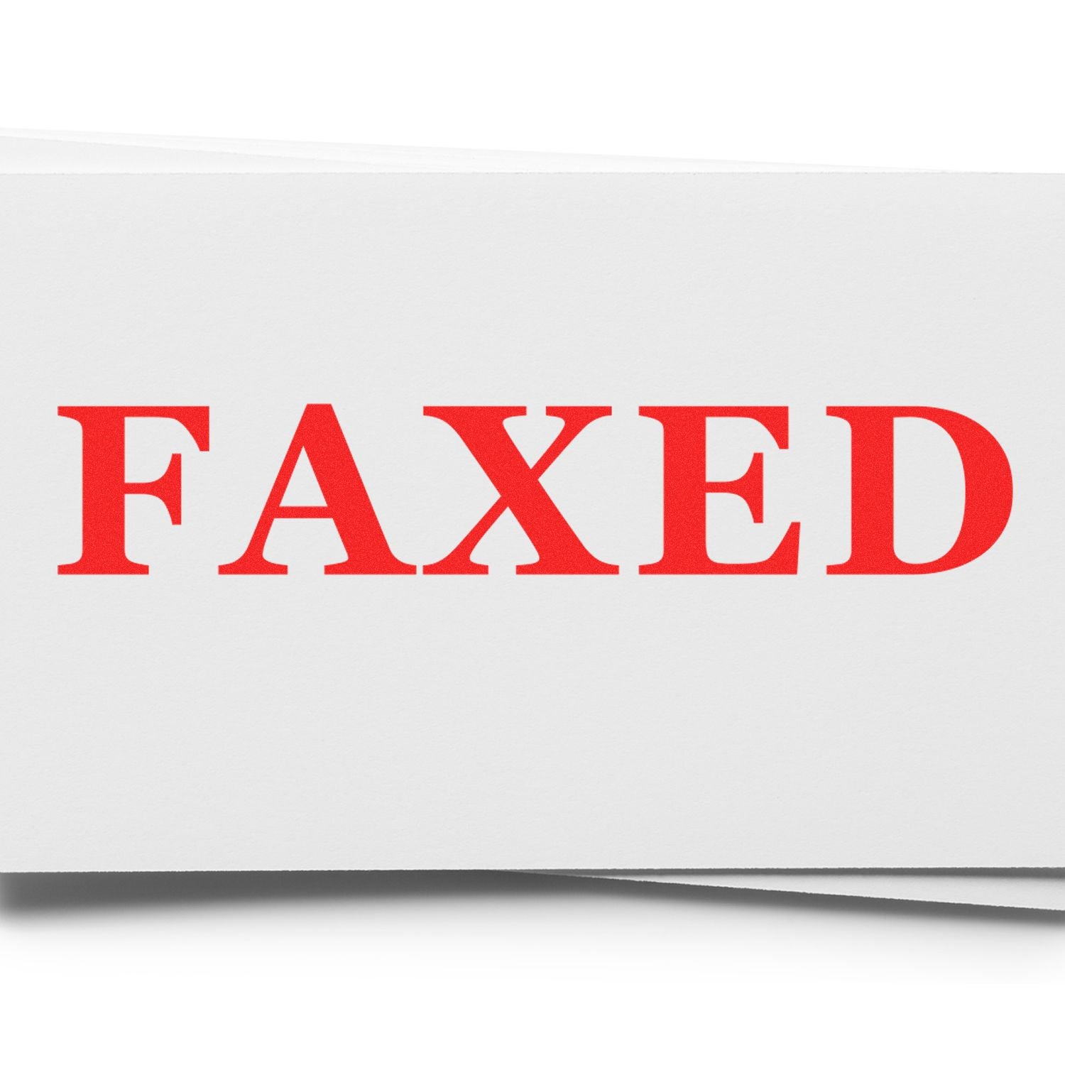 Slim Pre-Inked Times Faxed Stamp in use, displaying a bold red "FAXED" imprint on white paper.