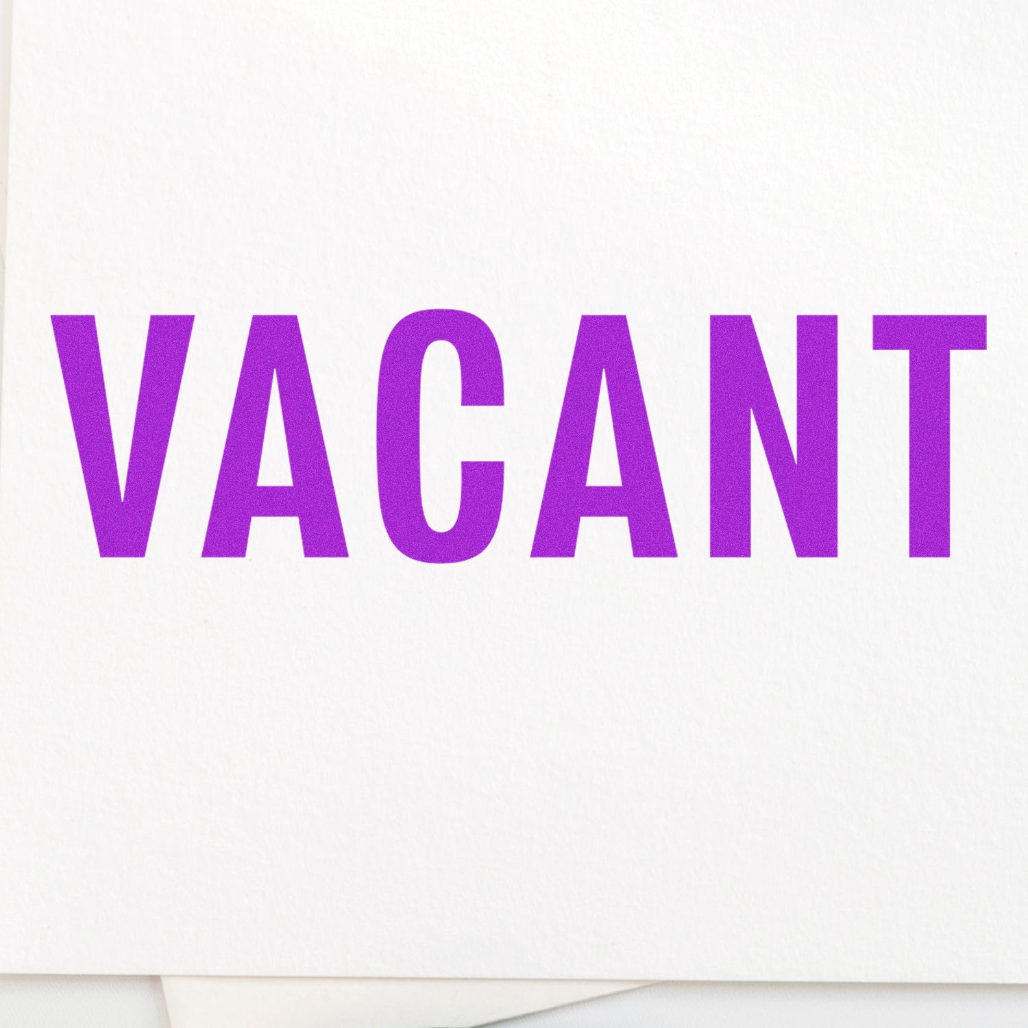 Image of a Large Self Inking Vacant Stamp imprint showing the word VACANT in bold purple letters on a white background.