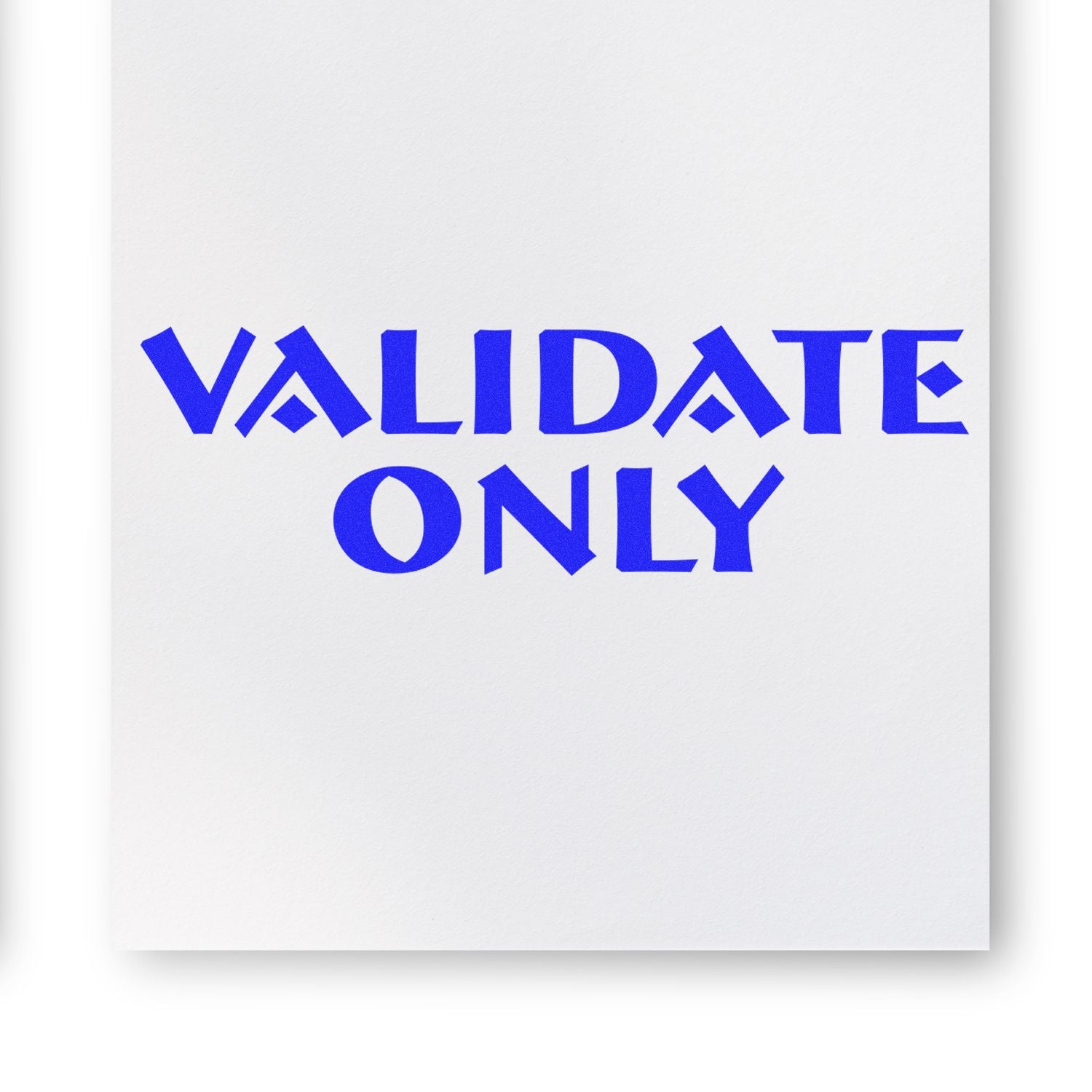 Blue 'VALIDATE ONLY' text stamped on white paper using the Self Inking Validate Only Stamp.