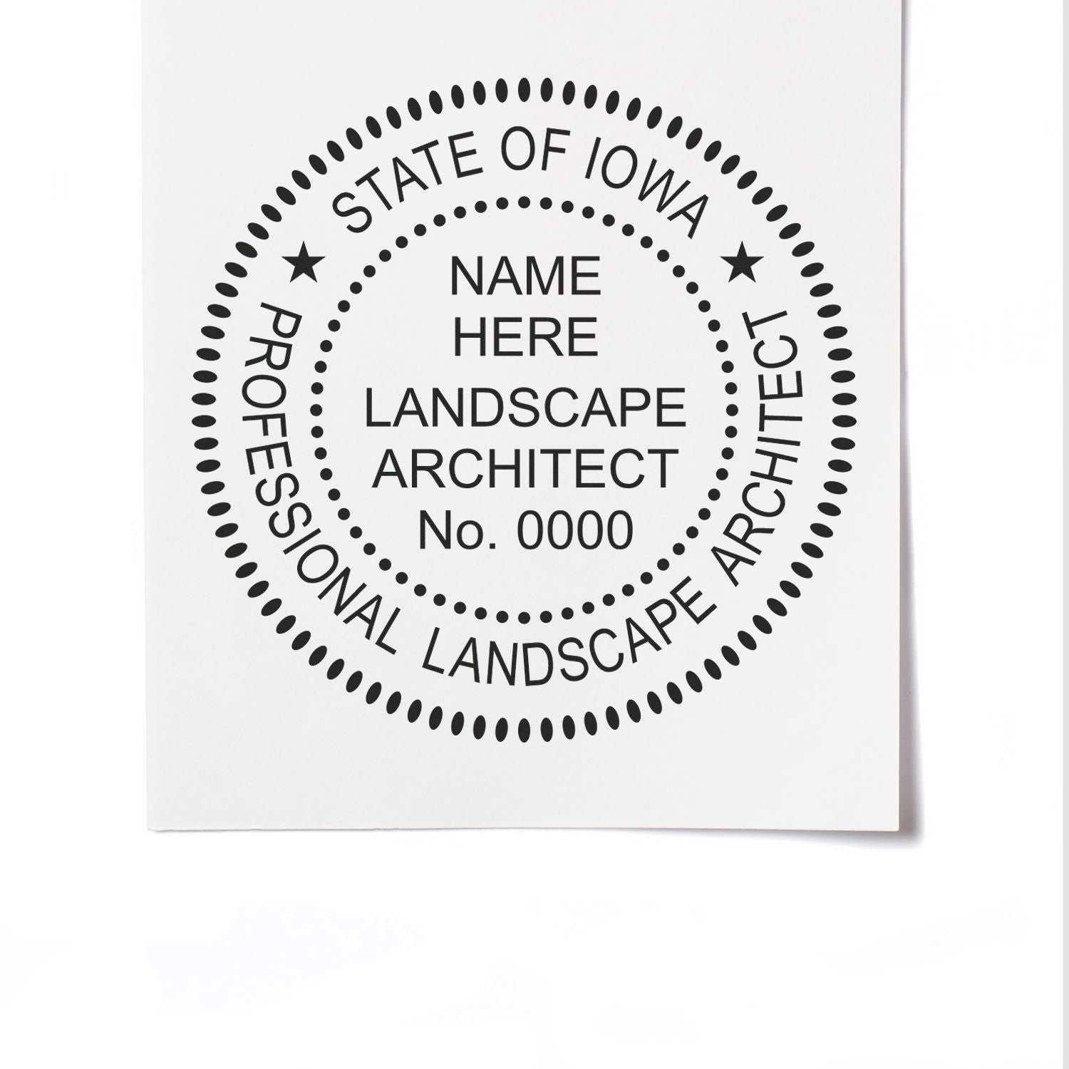 A lifestyle photo showing a stamped image of the Digital Iowa Landscape Architect Stamp on a piece of paper