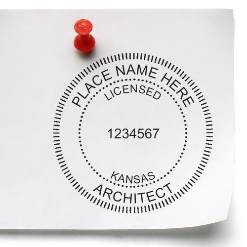 Self Inking Kansas Architect Stamp on white paper pinned with a red pushpin, showing a customizable seal with license number and place name.