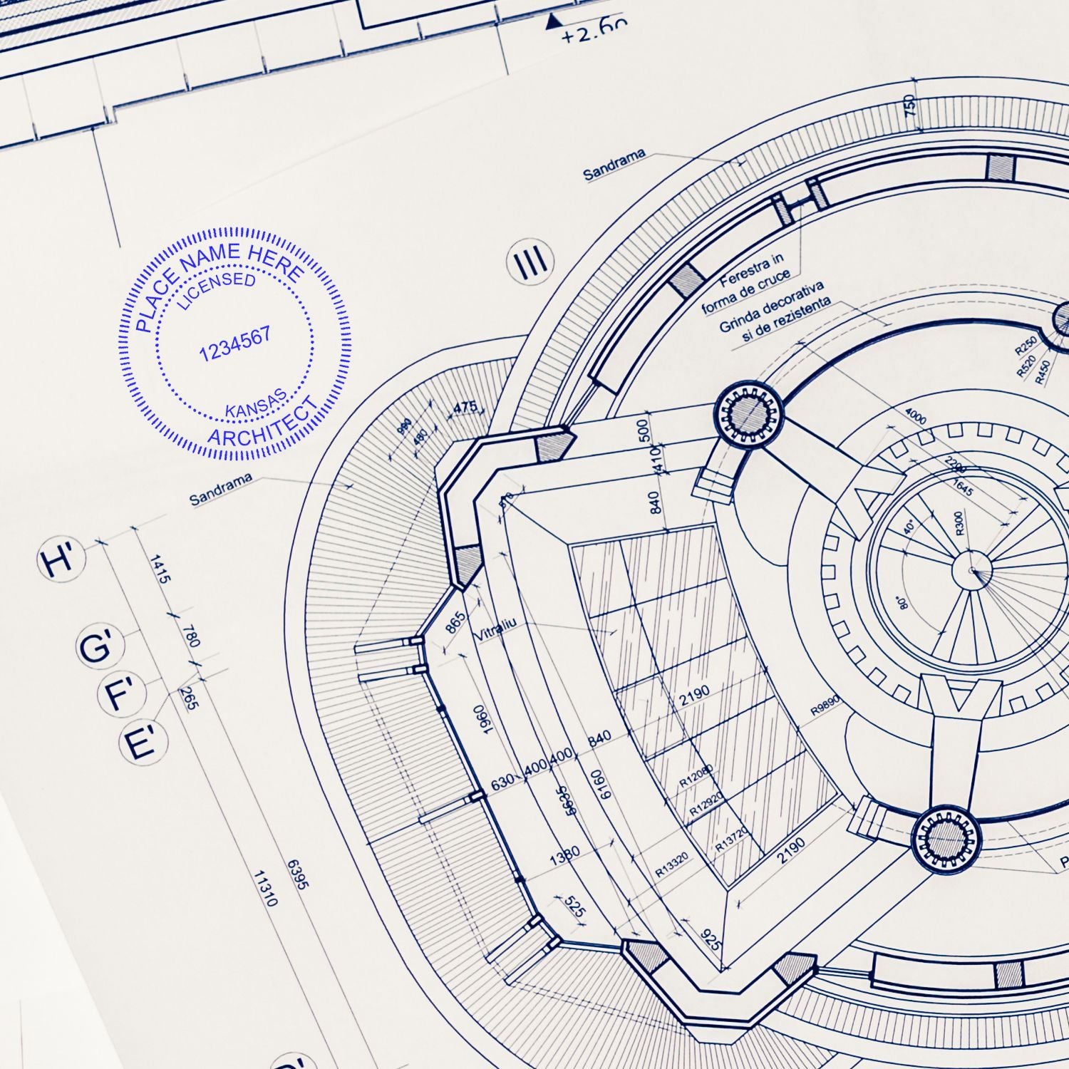 Blueprint with a Kansas Architect Seal Stamp in blue ink, showing detailed architectural plans and measurements.