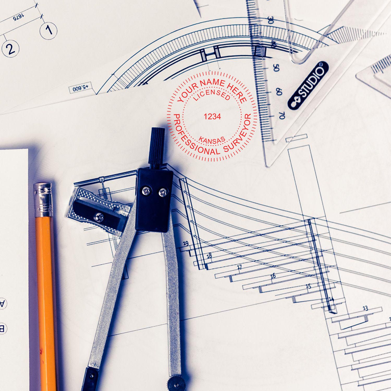 Kansas Land Surveyor Seal Stamp, KS PLS Stamp on architectural blueprints with drafting tools and a pencil.