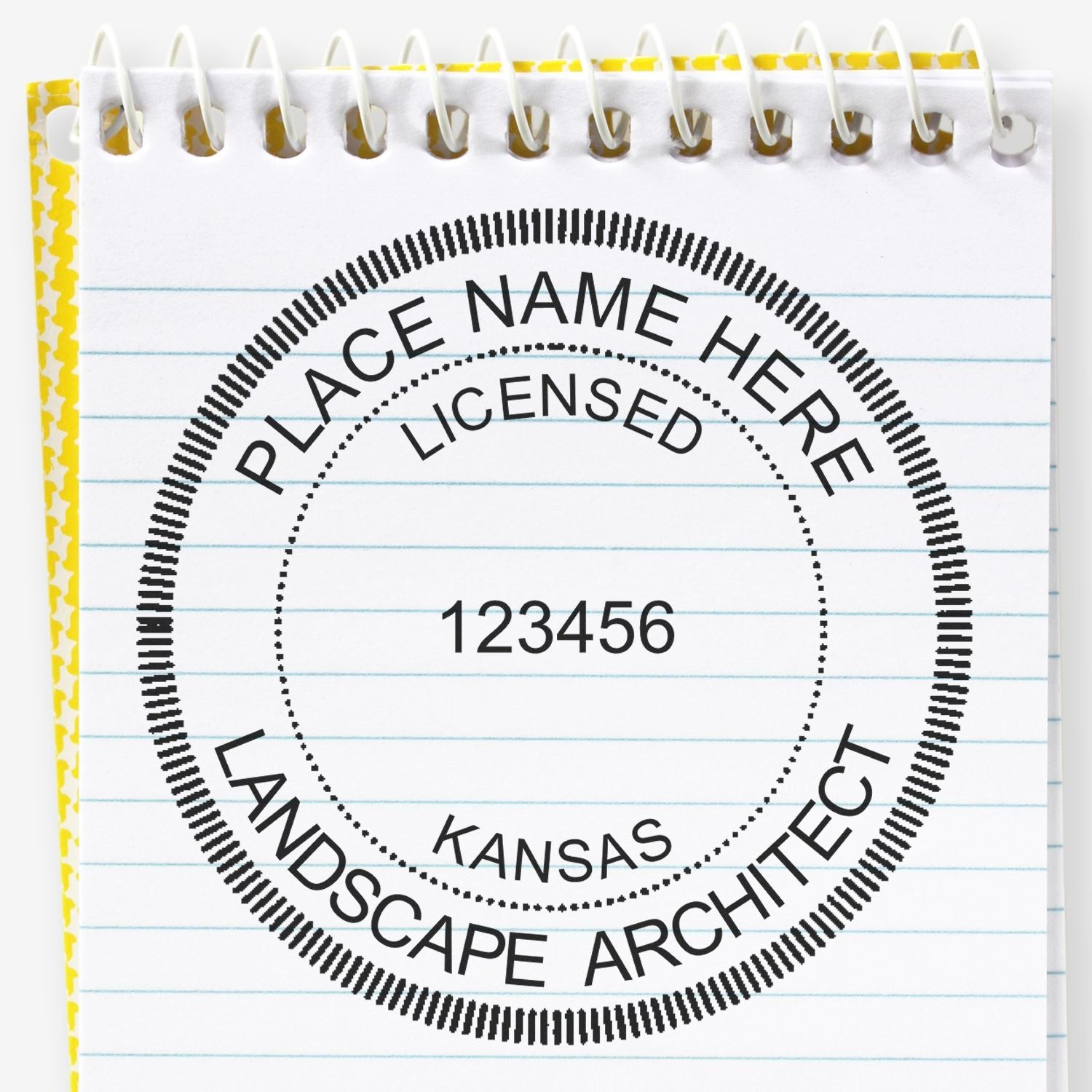 A lifestyle photo showing a stamped image of the Digital Kansas Landscape Architect Stamp on a piece of paper