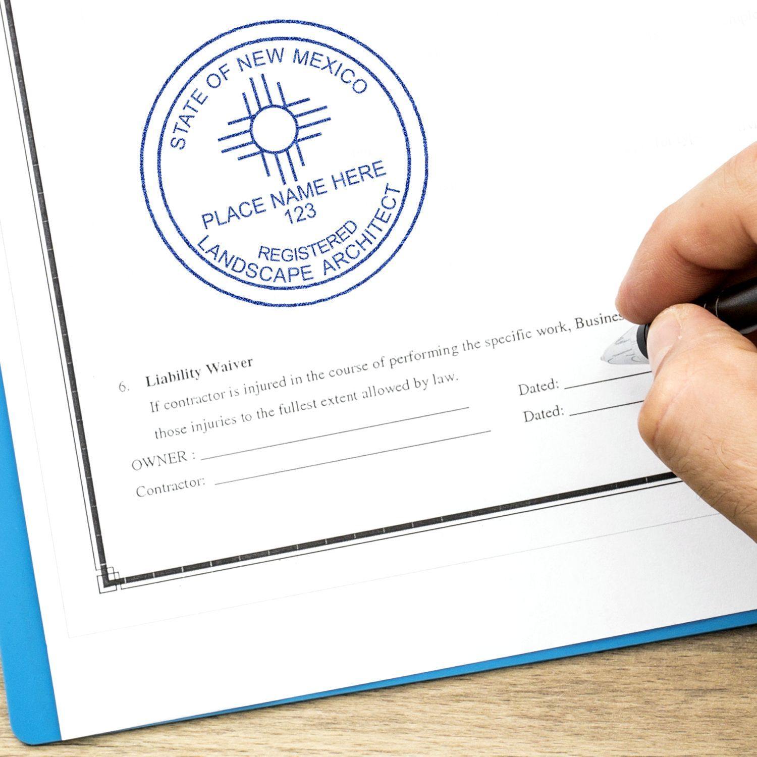 A hand using the Landscape Architect eSeal Electronic Image Stamp of Seal on a document, showing a blue circular seal for a registered architect.