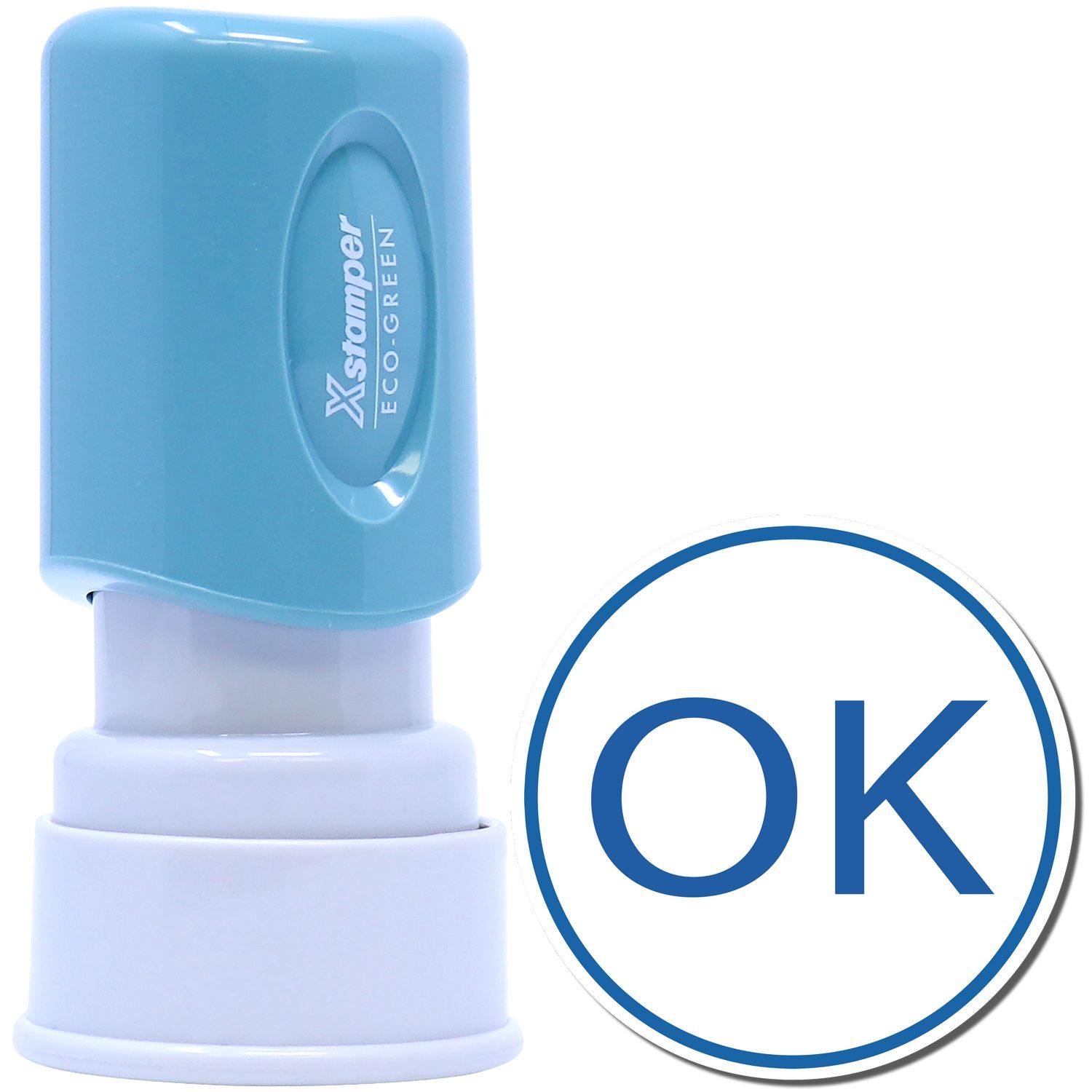 Round Ok Xstamper Stamp with a blue cap and white base, featuring a large OK imprint in blue within a circle.