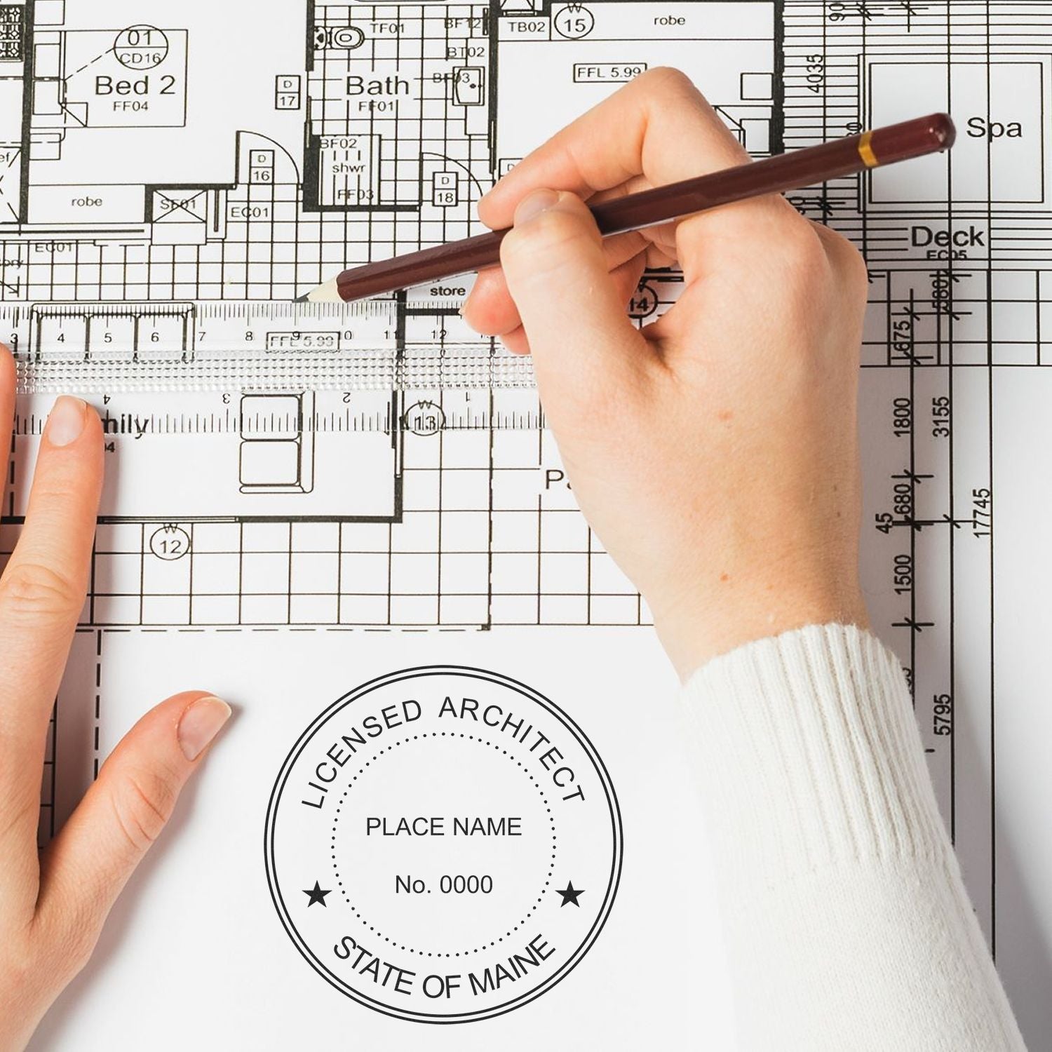 Hands drawing on architectural plans with a ruler and pencil, featuring a Maine Architect Seal Stamp in the bottom left corner.