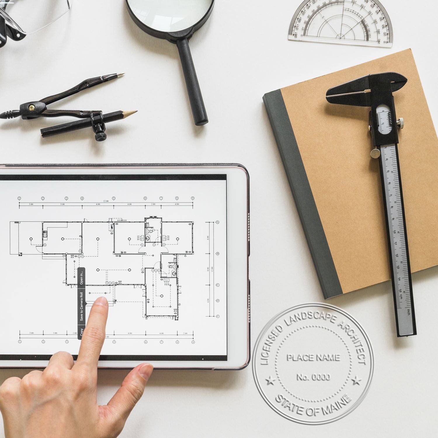 A photograph of the Maine Desk Landscape Architectural Seal Embosser stamp impression reveals a vivid, professional image of the on paper.