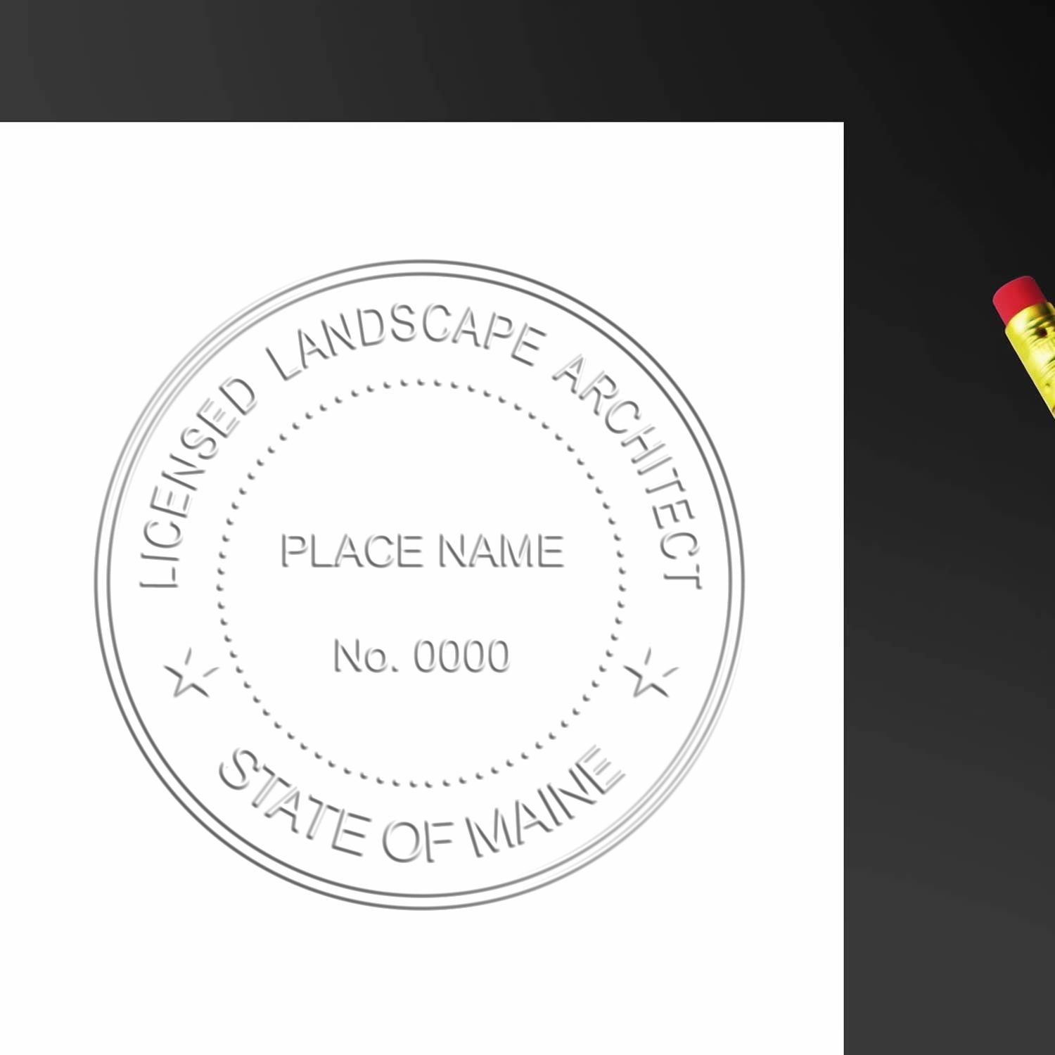 An alternative view of the Heavy Duty Maine Landscape Architect Cast Iron Embosser stamped on a sheet of paper showing the image in use