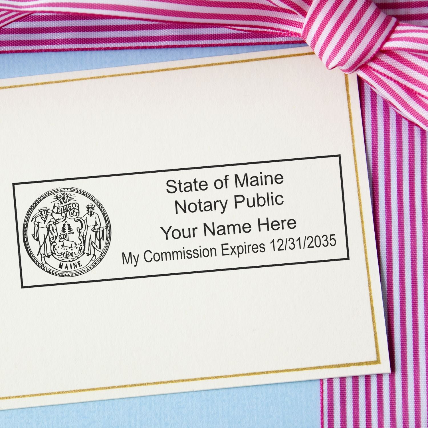 A lifestyle photo showing a stamped image of the Heavy-Duty Maine Rectangular Notary Stamp on a piece of paper