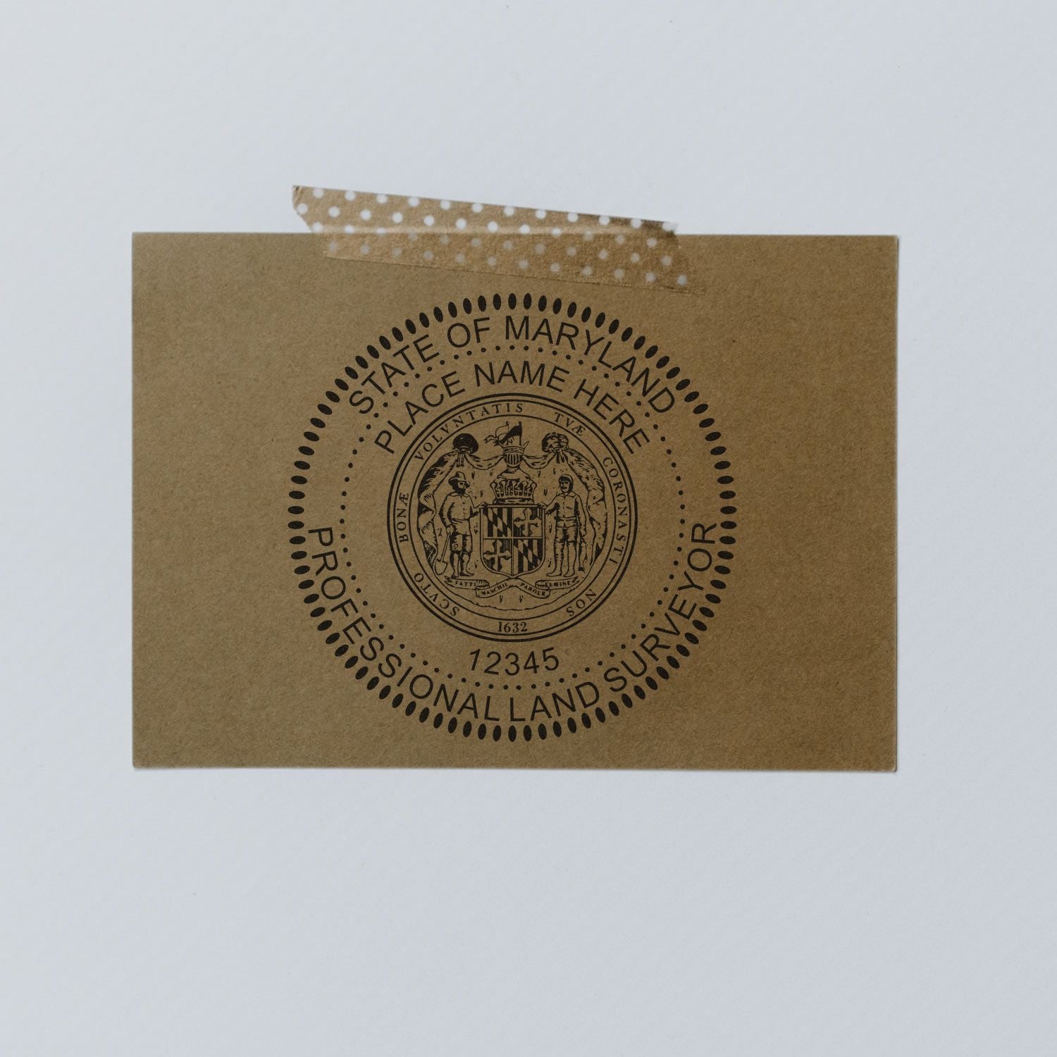 Maryland Land Surveyor Seal Stamp, MD PLS Stamp on a brown envelope taped to a white wall.