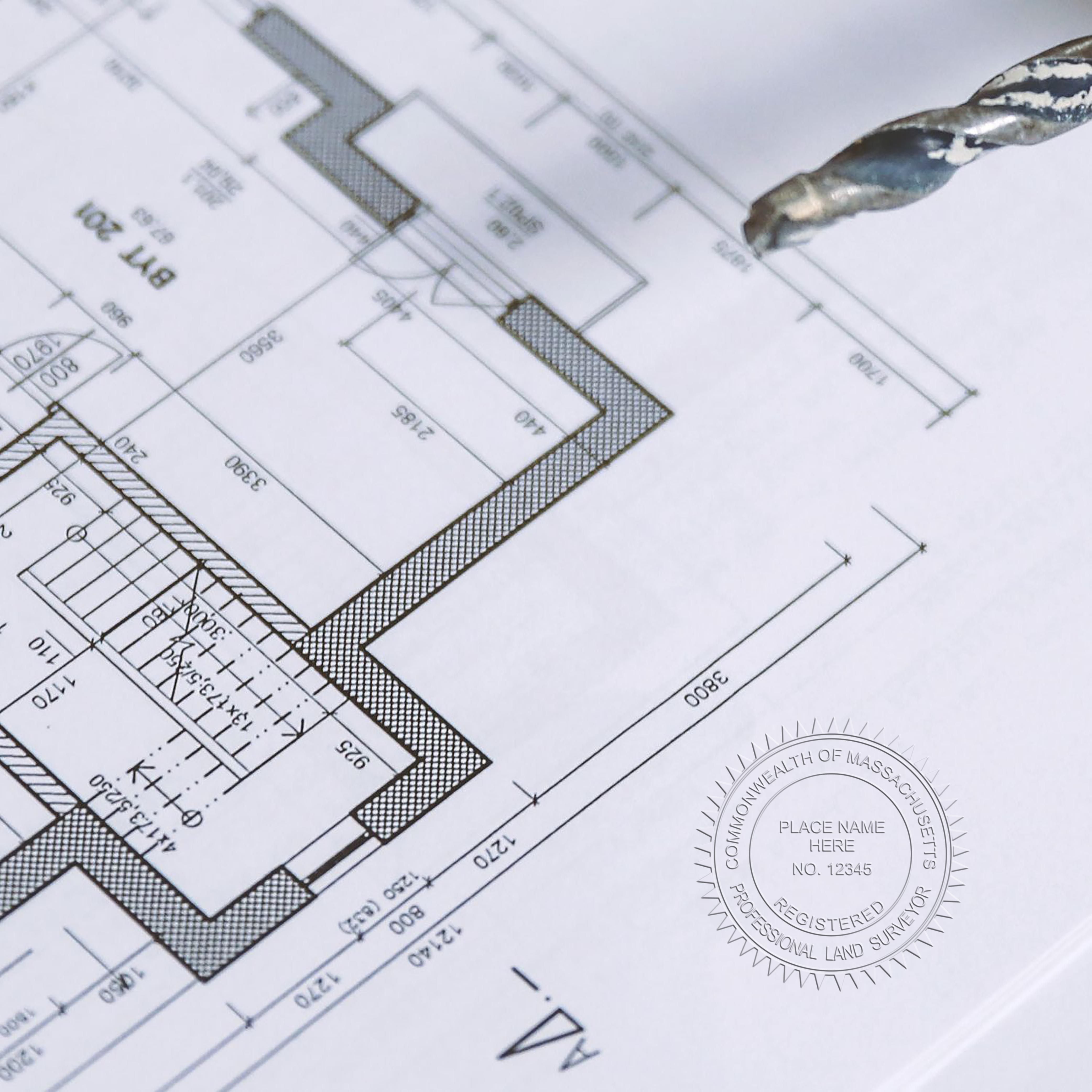 Another Example of a stamped impression of the Handheld Massachusetts Land Surveyor Seal on a piece of office paper.