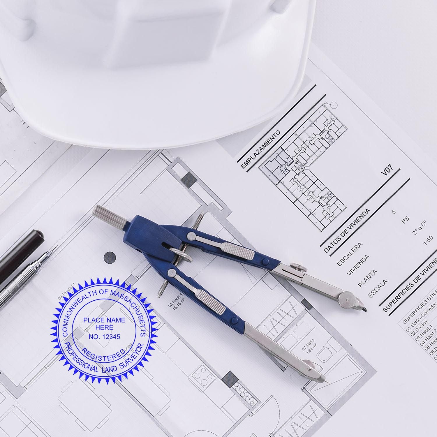 Massachusetts Land Surveyor Seal Stamp on architectural plans with a compass, pen, and hard hat in the background.