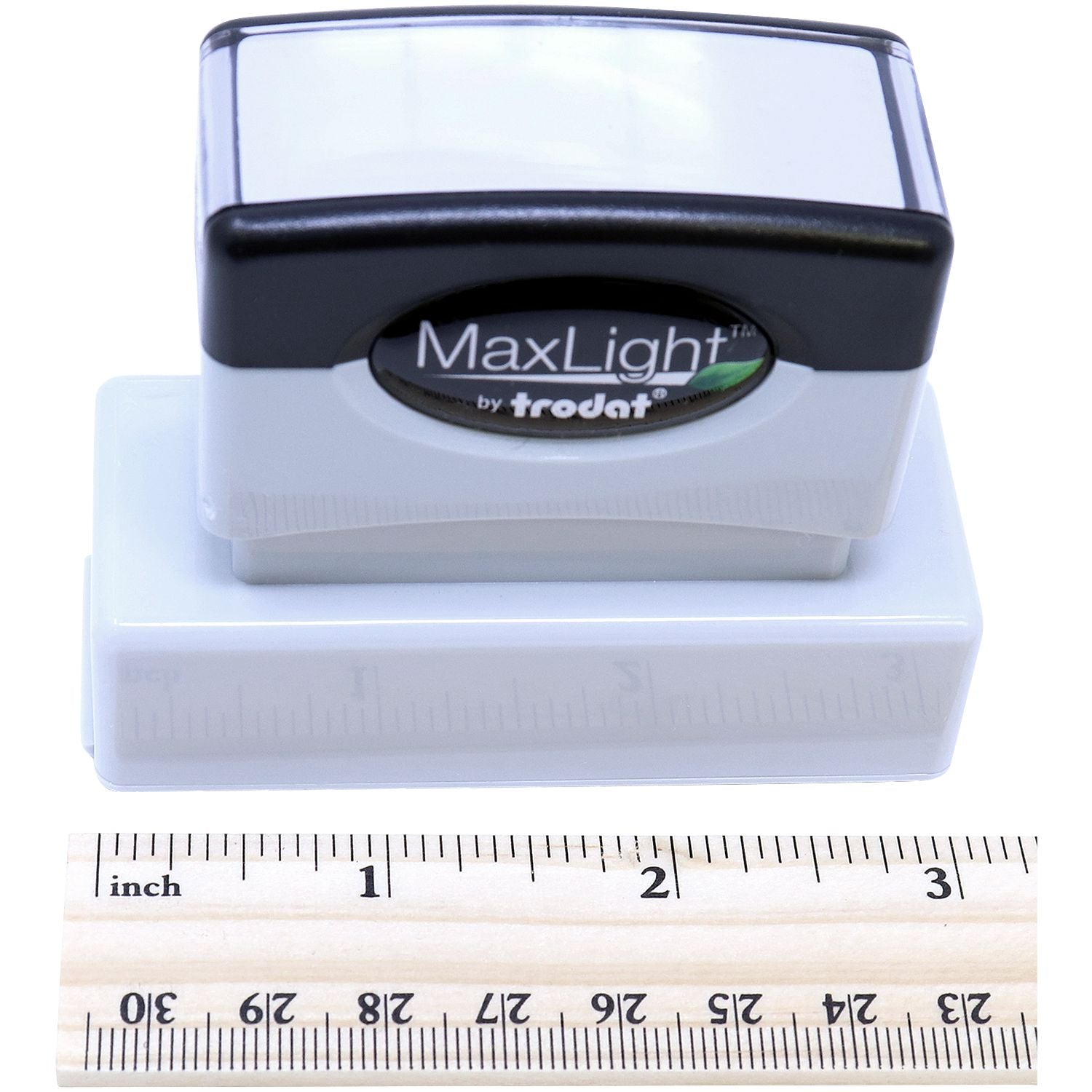 MaxLight XL2-145 Custom Pre-Inked Business Stamp 5/8 x 2-3/8 shown with a ruler for scale, highlighting its compact size and design.