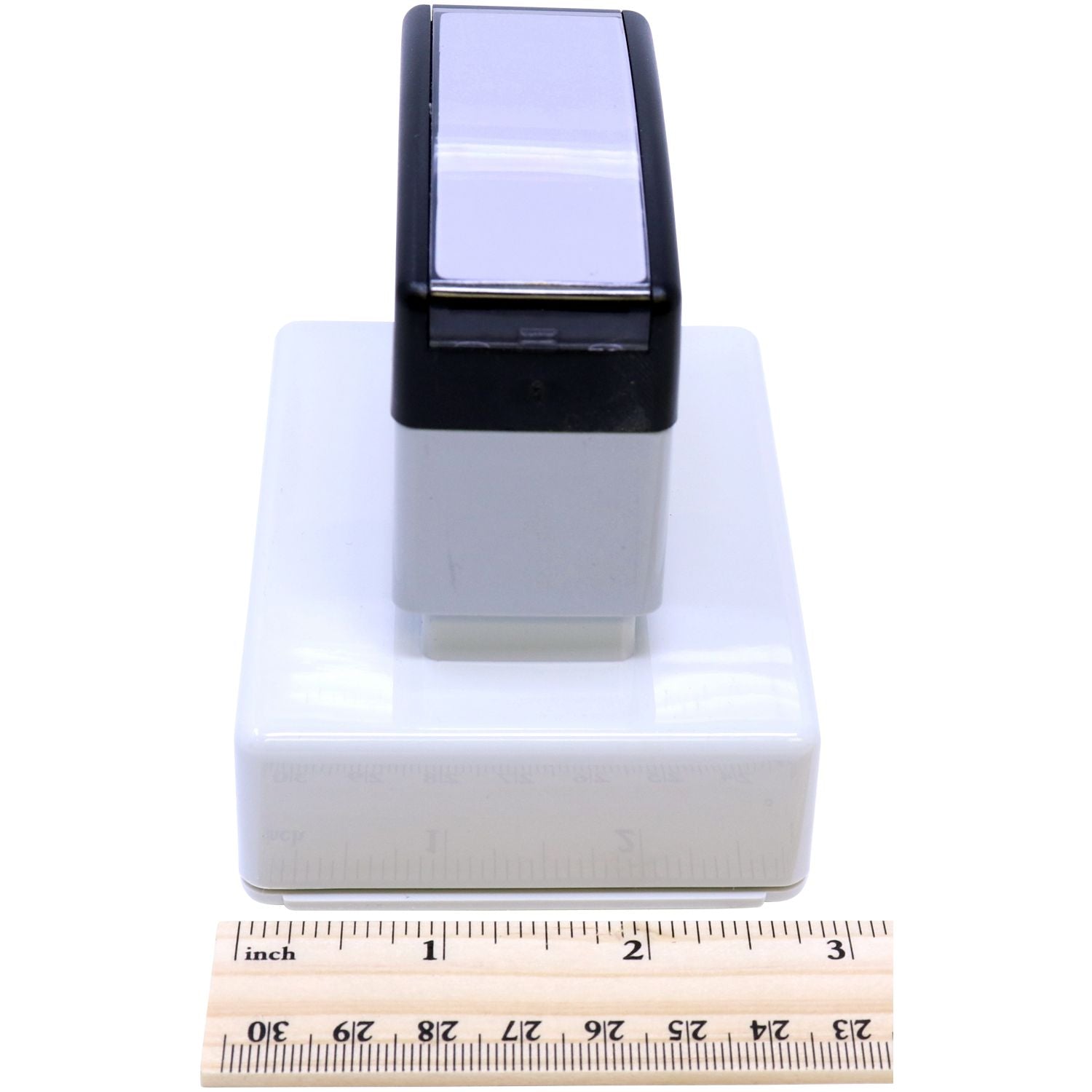 MaxLight XL2-145 Custom Pre-Inked Business Stamp 5/8 x 2-3/8 shown with a ruler for scale, highlighting its compact size and sleek design.