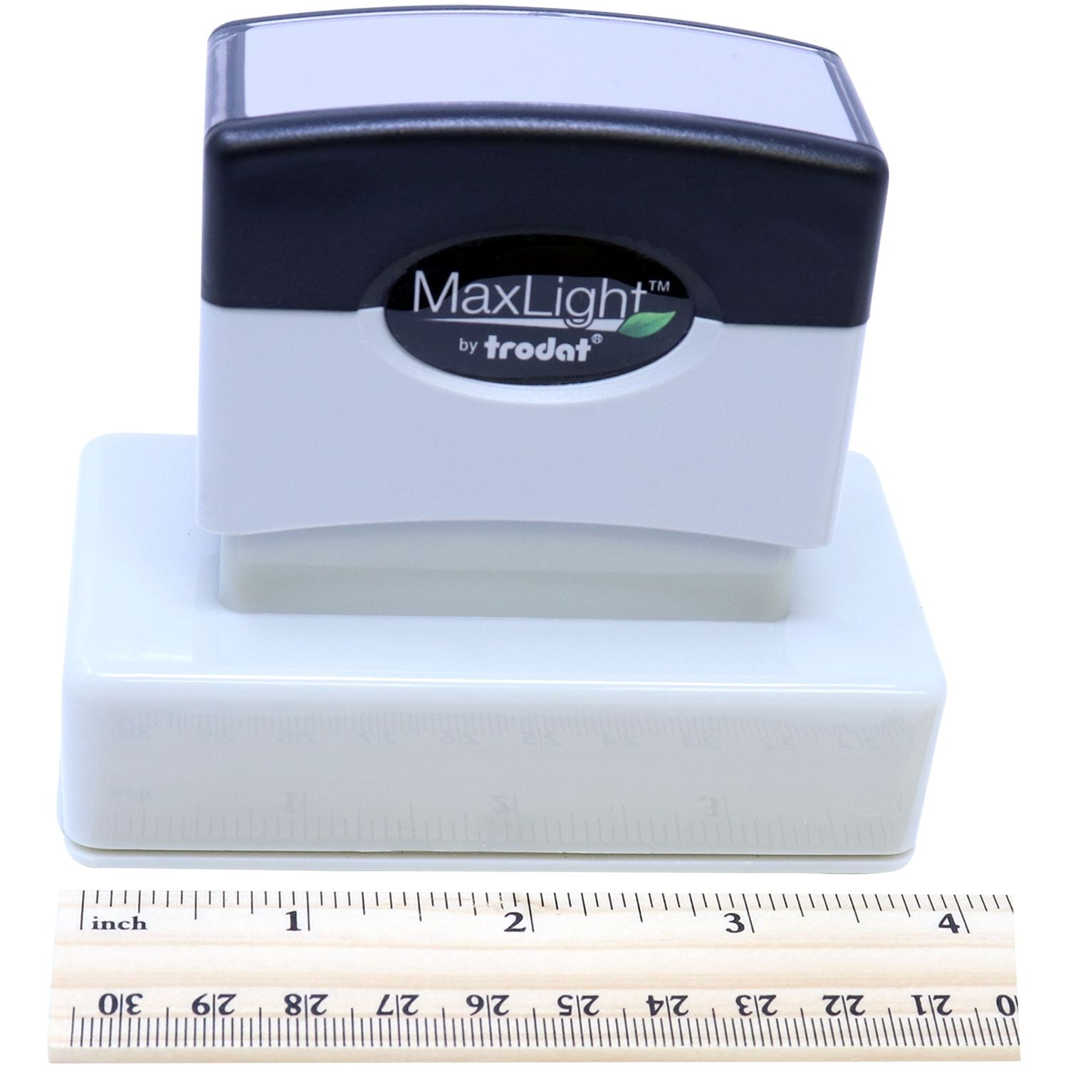 MaxLight XL2-245 Custom Pre-Inked Business Stamp 1-1/4 x 3-3/16 shown with a ruler for scale, highlighting its compact size.