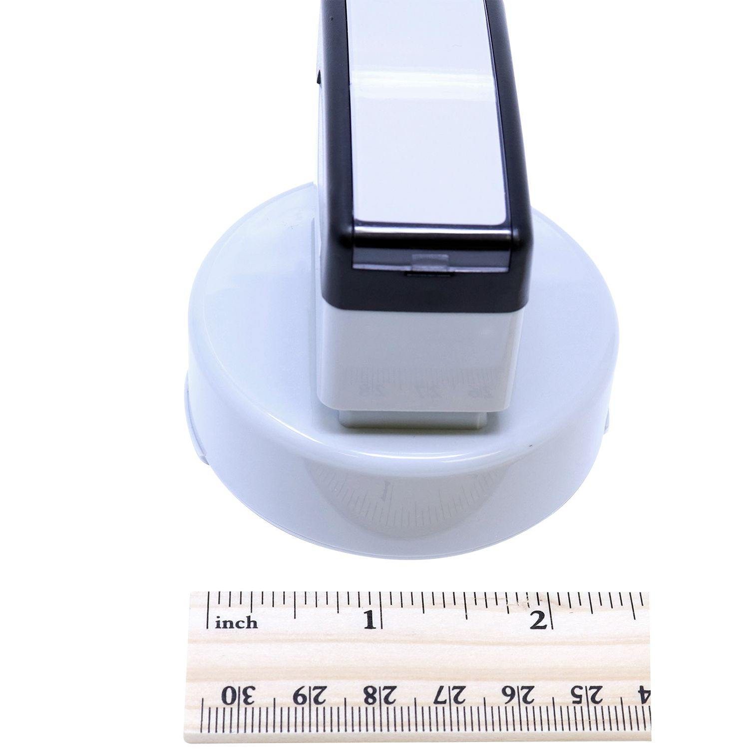 Landscape Architect MaxLight Pre Inked Rubber Stamp of Seal, shown next to a ruler for size reference, with a white and black design.