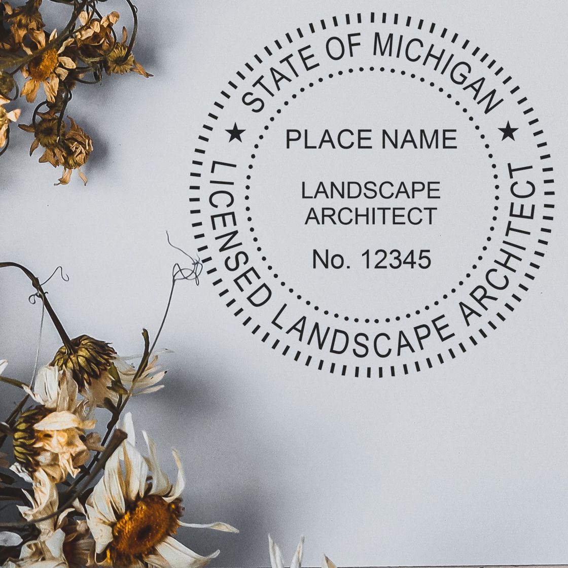 A lifestyle photo showing a stamped image of the Digital Michigan Landscape Architect Stamp on a piece of paper