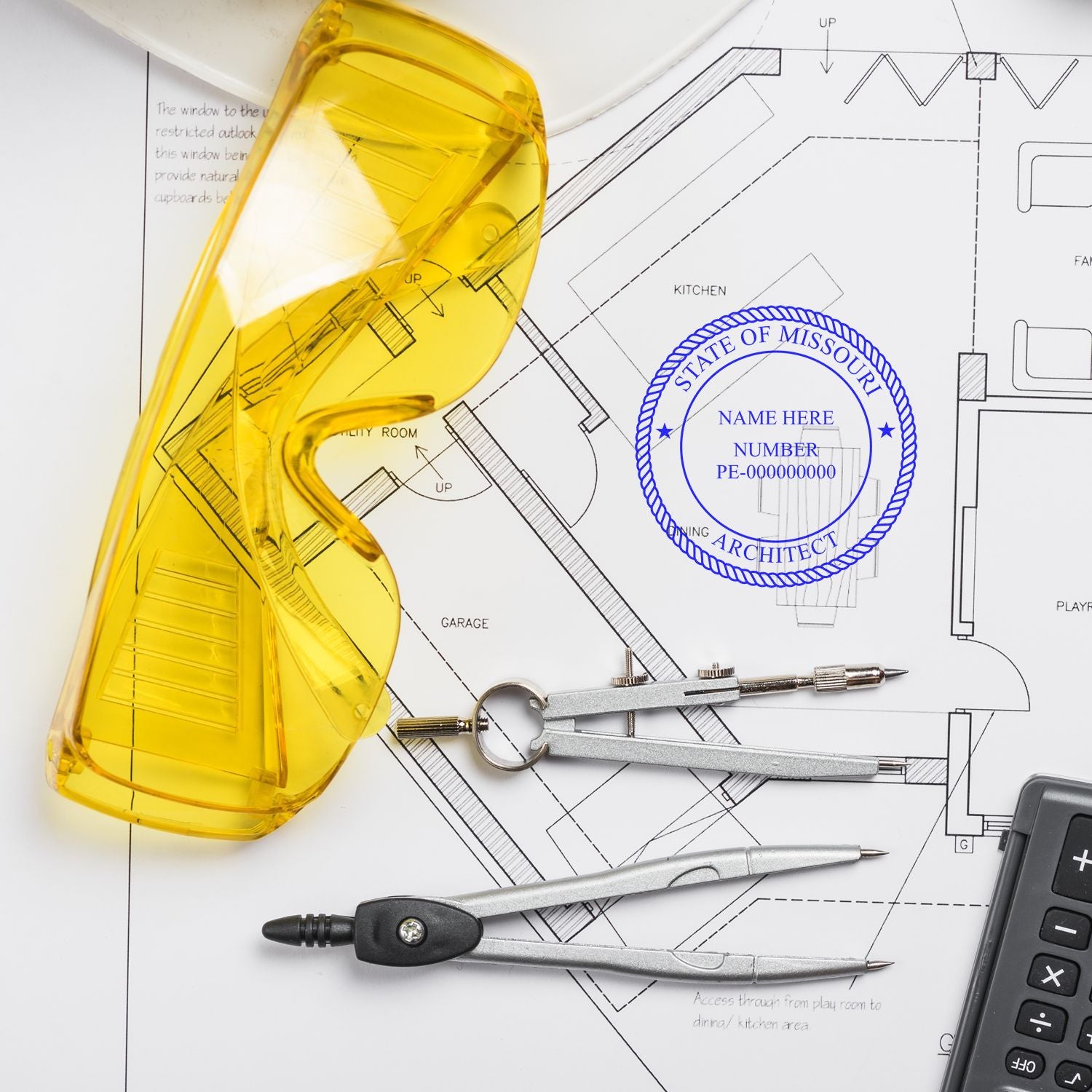 Yellow safety glasses, compass, and Self Inking Missouri Architect Stamp on architectural plans.