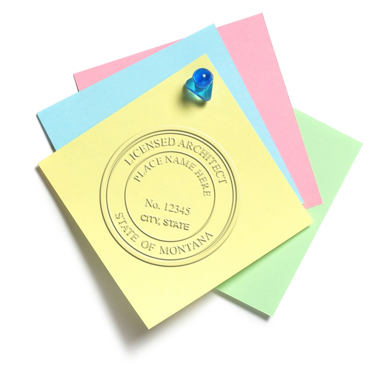 An in use photo of the Gift Montana Architect Seal showing a sample imprint on a cardstock