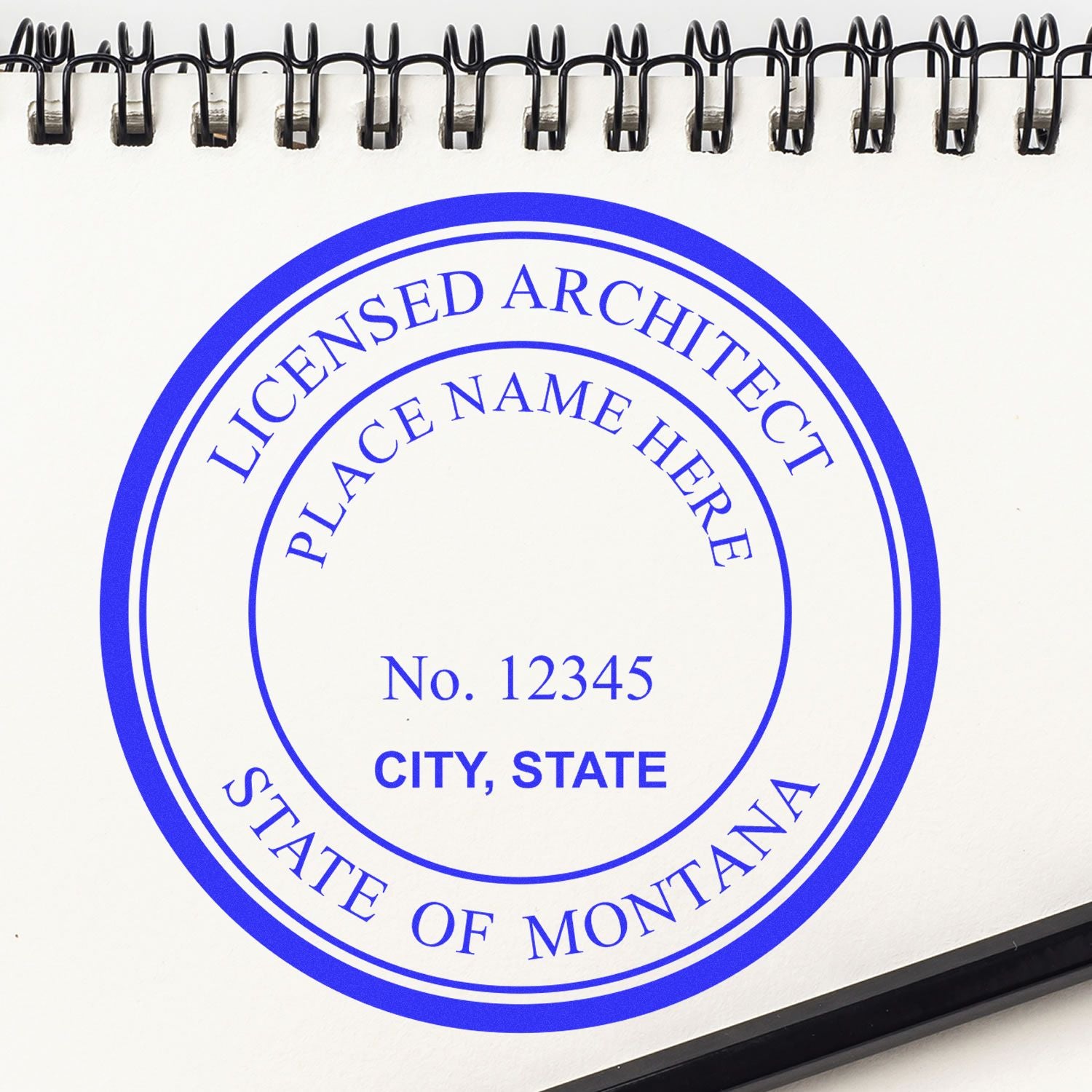 Self Inking Montana Architect Stamp on white paper with a blue circular design, customizable with name, number, city, and state.