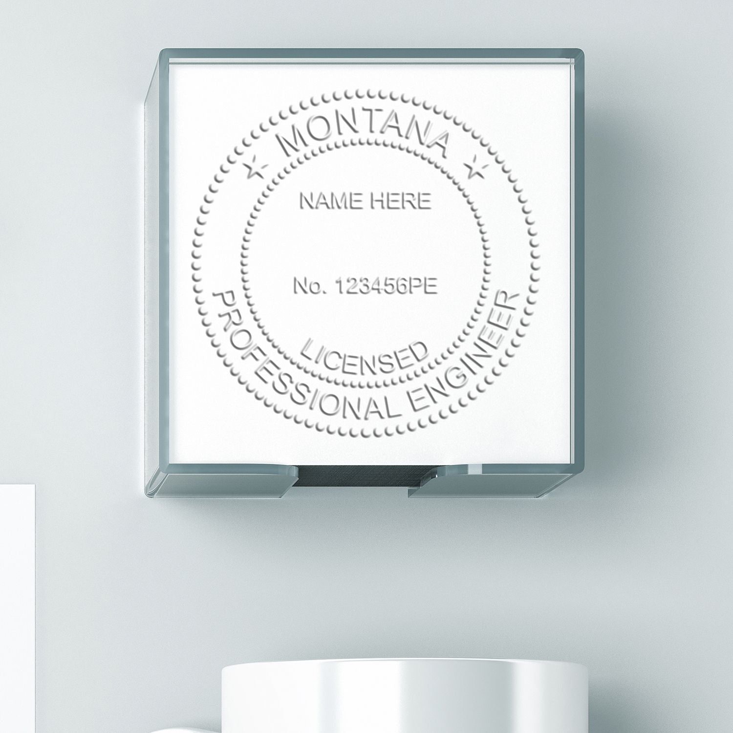 An alternative view of the Hybrid Montana Engineer Seal stamped on a sheet of paper showing the image in use