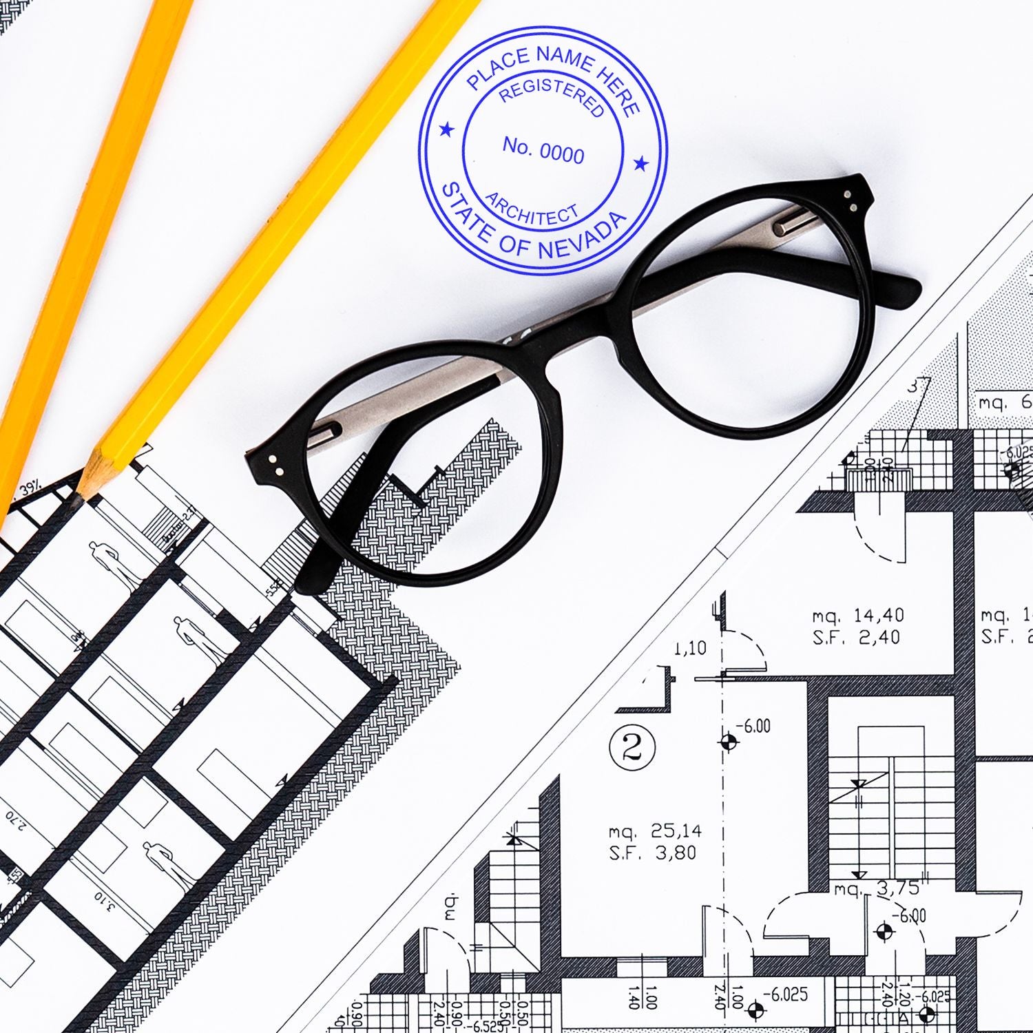 Self Inking Nevada Architect Stamp on architectural blueprints with glasses and pencils nearby.