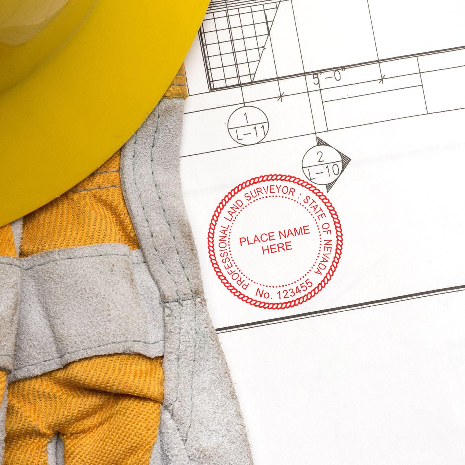 Digital Nevada Land Surveyor Stamp, Electronic Seal for Nevada Land Surveyor on a blueprint next to a yellow hard hat and gloves.