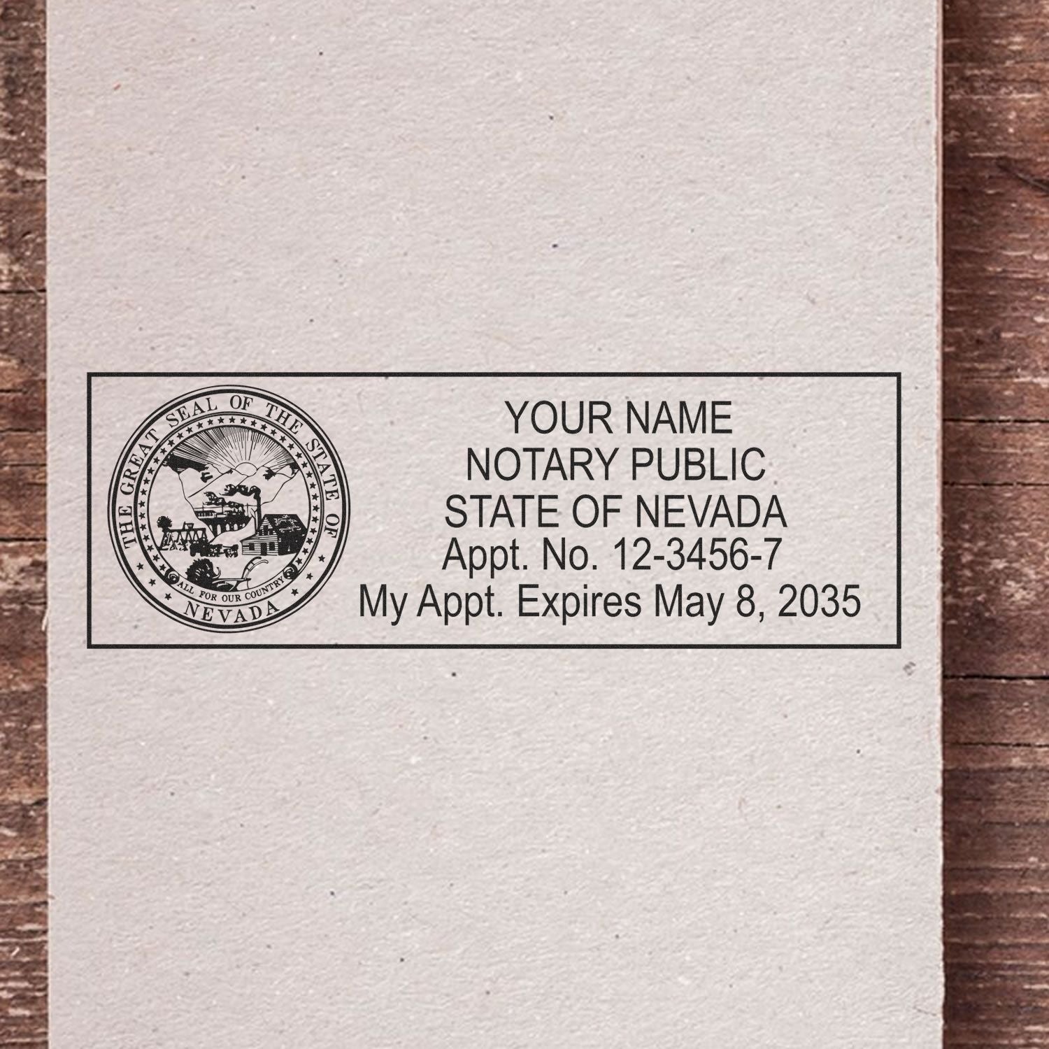 A lifestyle photo showing a stamped image of the Heavy-Duty Nevada Rectangular Notary Stamp on a piece of paper