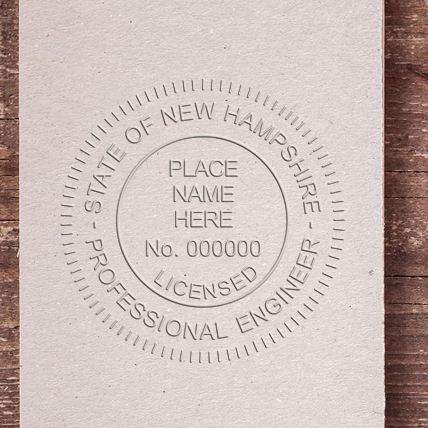 The State of New Hampshire Extended Long Reach Engineer Seal stamp impression comes to life with a crisp, detailed photo on paper - showcasing true professional quality.